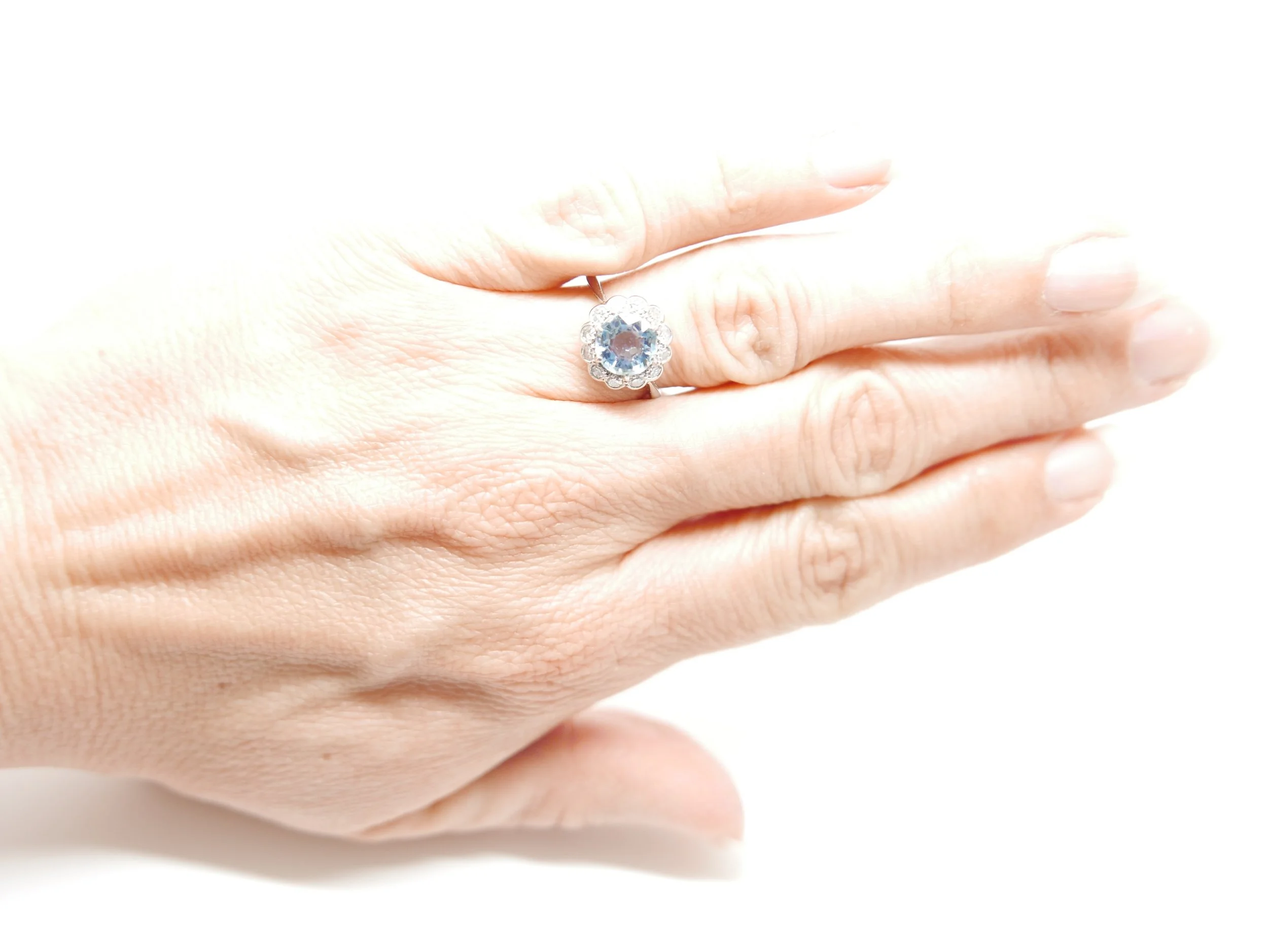 Art Deco round aquamarine and diamond ring in 18ct and platinum. Engraved with 1938 date.