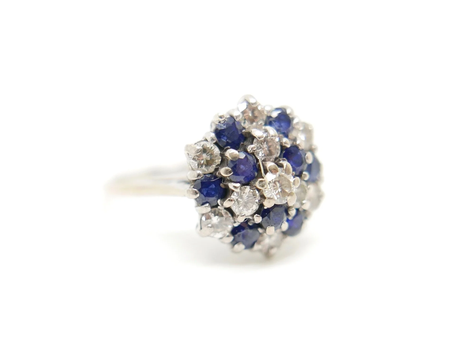 Vintage 18ct gold sapphire and diamond cluster ring, set with a mix of round cut sapphires and brilliant cut diamonds.