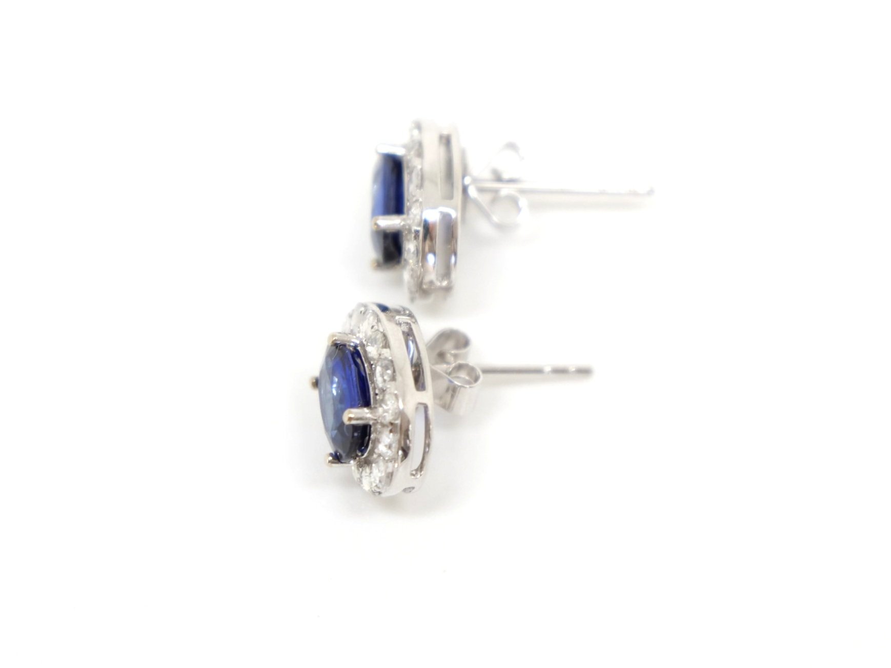 Lovely sapphire and diamond earrings, set in 18ct white gold. Central oval cut sapphire of approximately 1ct, surrounded by rose cut diamonds.