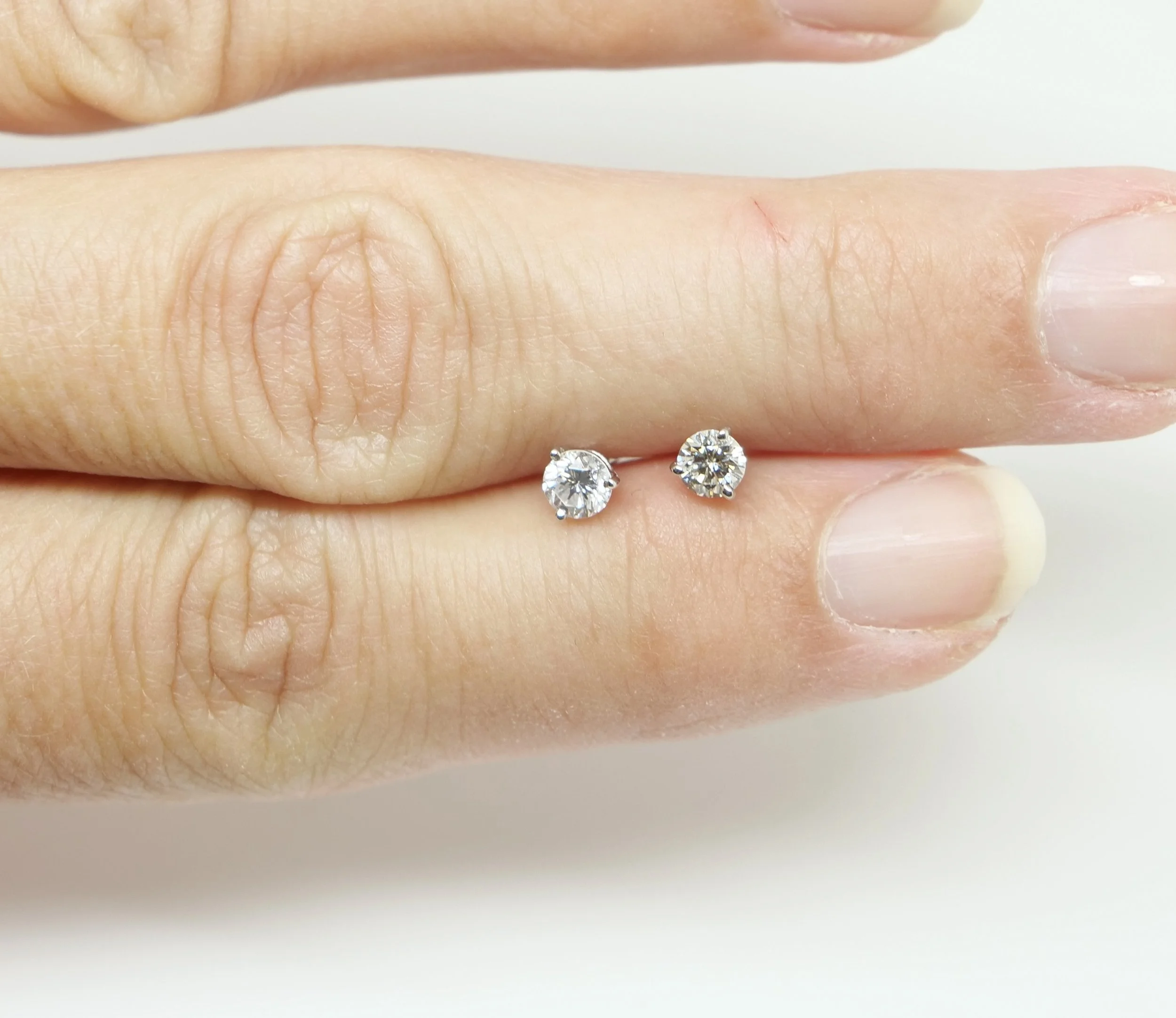 Stunning sparkly diamond stud earrings, each set with a lively 0.25ct brilliant cut diamond (0.5ct total). Classic three prong setting in 18ct white gold. With 18ct white gold butterfly backs.