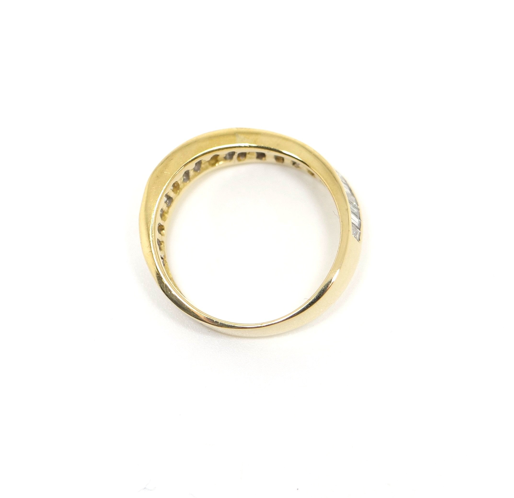 Very unusual diamond half eternity ring, set with large baguette diamonds in a wonderful wavy style. The ring is 18ct gold and is hallmarked.