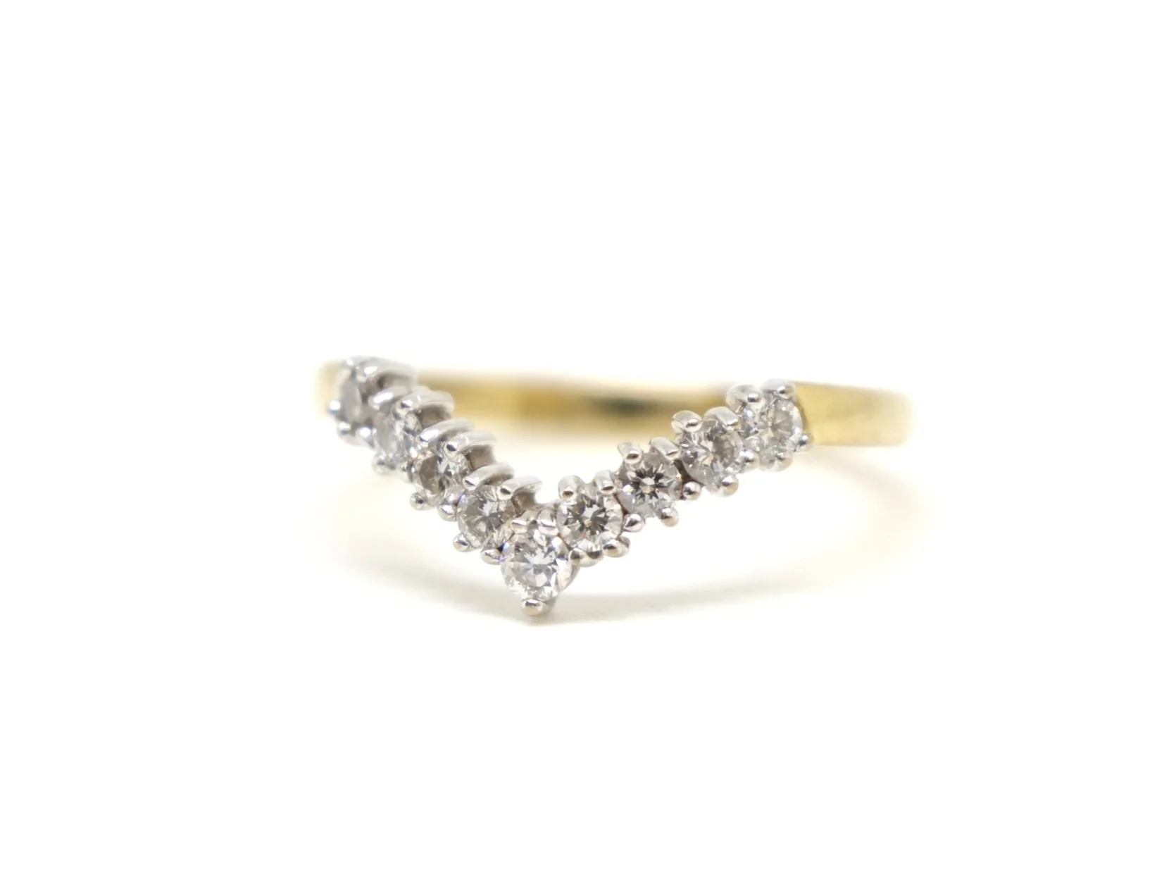 Very sparkly diamond wishbone ring, set with nine brilliant cut diamonds in the classic V formation. All set in 18ct gold.