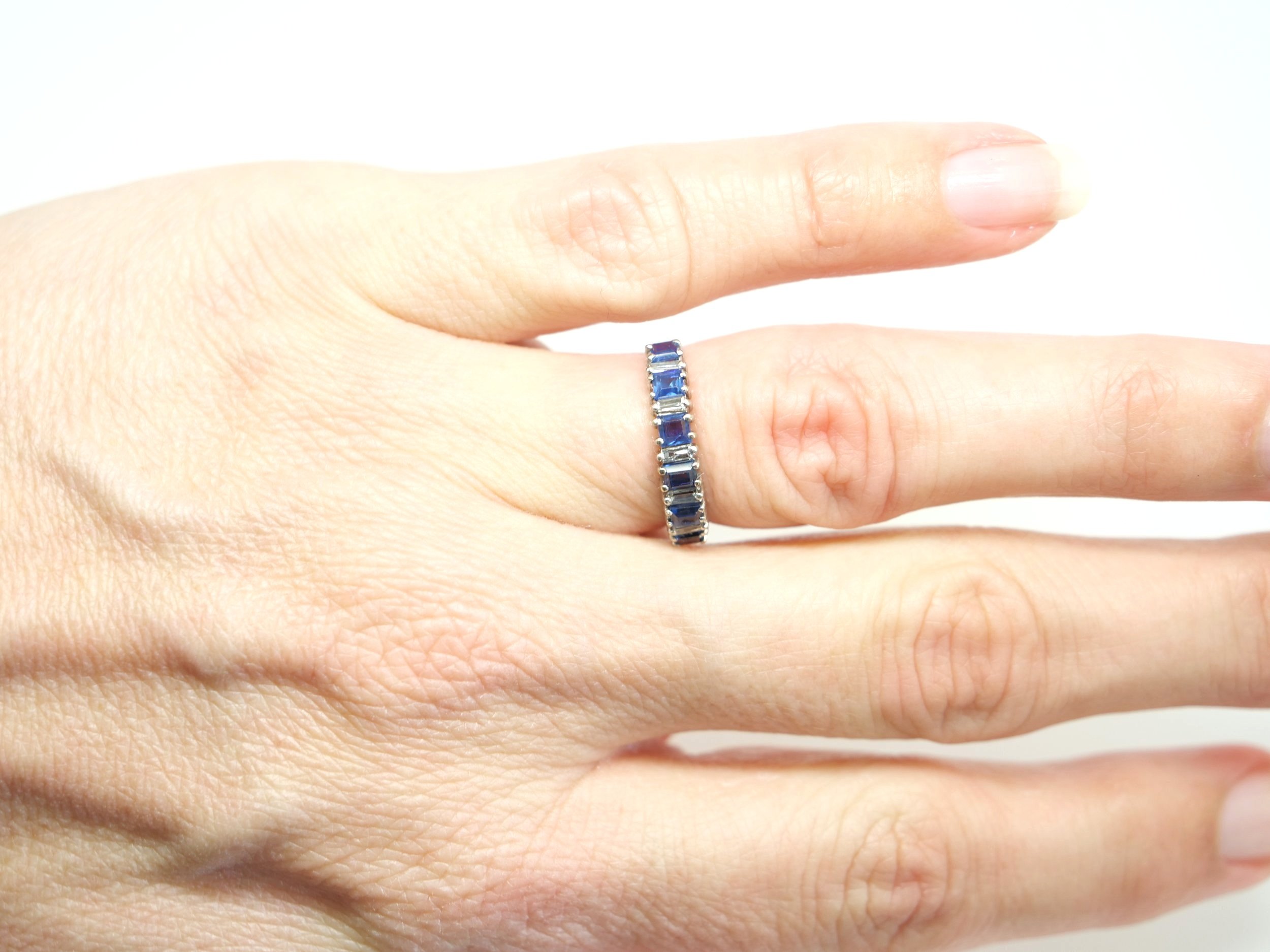 Unusual vintage sapphire and diamond half eternity ring, set with six square cut sapphires and five baguette cut diamonds. All set in 18ct gold.