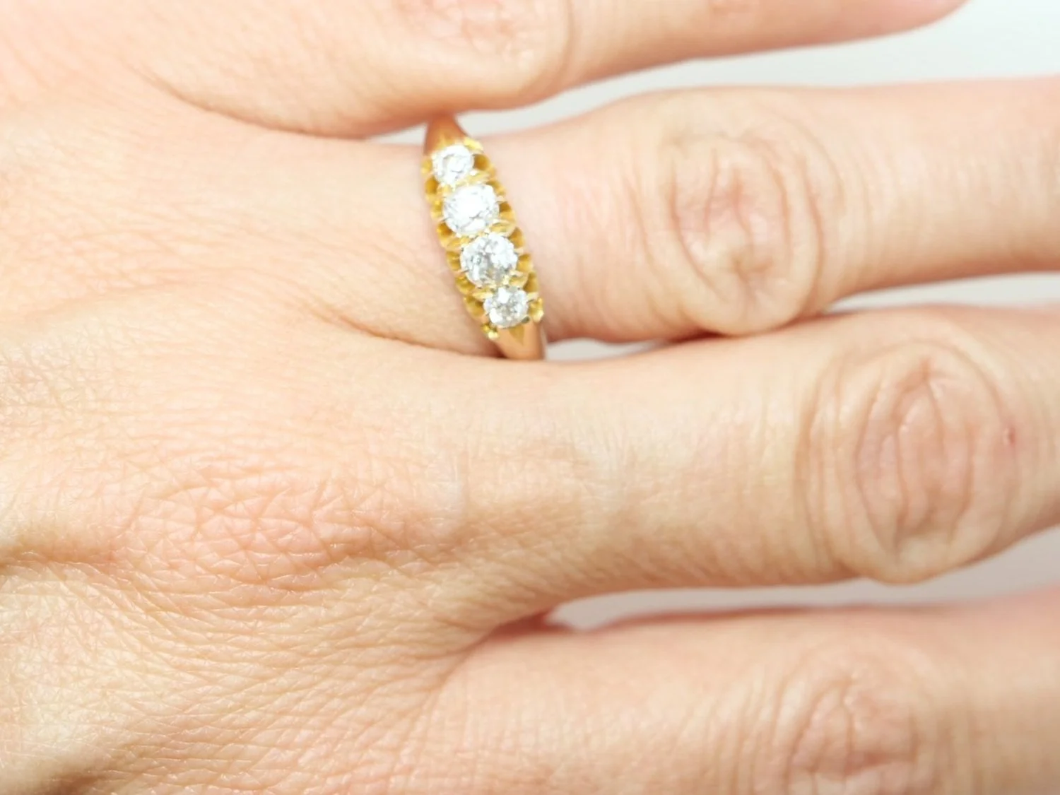 Beautiful 18ct gold vintage ring, set with four lovely old cut diamonds in this half hoop style. Approximately 0.6ct diamonds total.