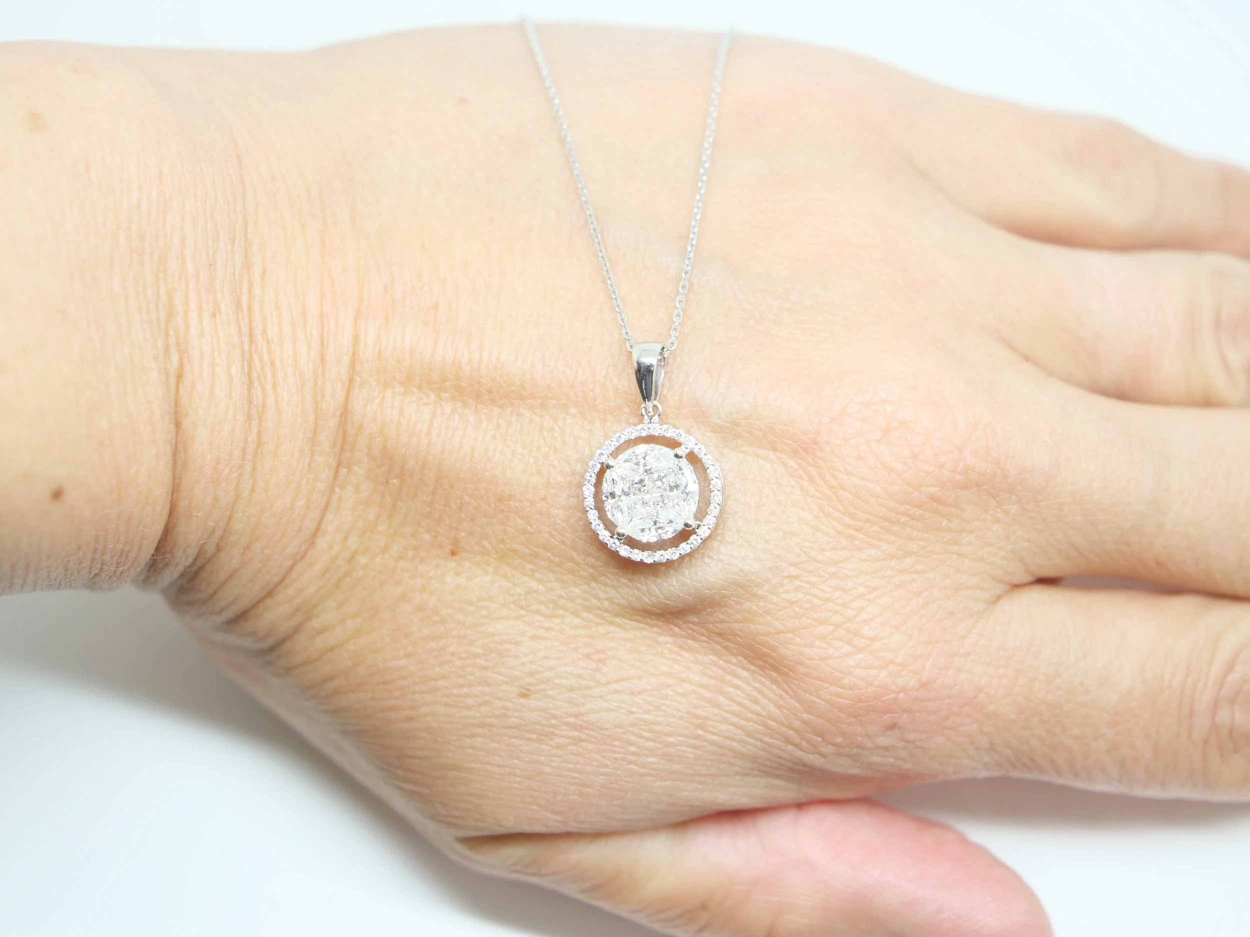 Lovely statement diamond cluster pendant, set with marquise and princess cut diamonds, with a brilliant cut diamond surround. Approximately 1.4cts diamonds in total.