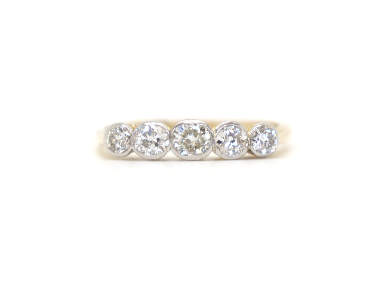 Gorgeous vintage 18ct gold and platinum five stone ring, set with five well matched old cut diamonds. Approximately 0.8cts total diamond weight.