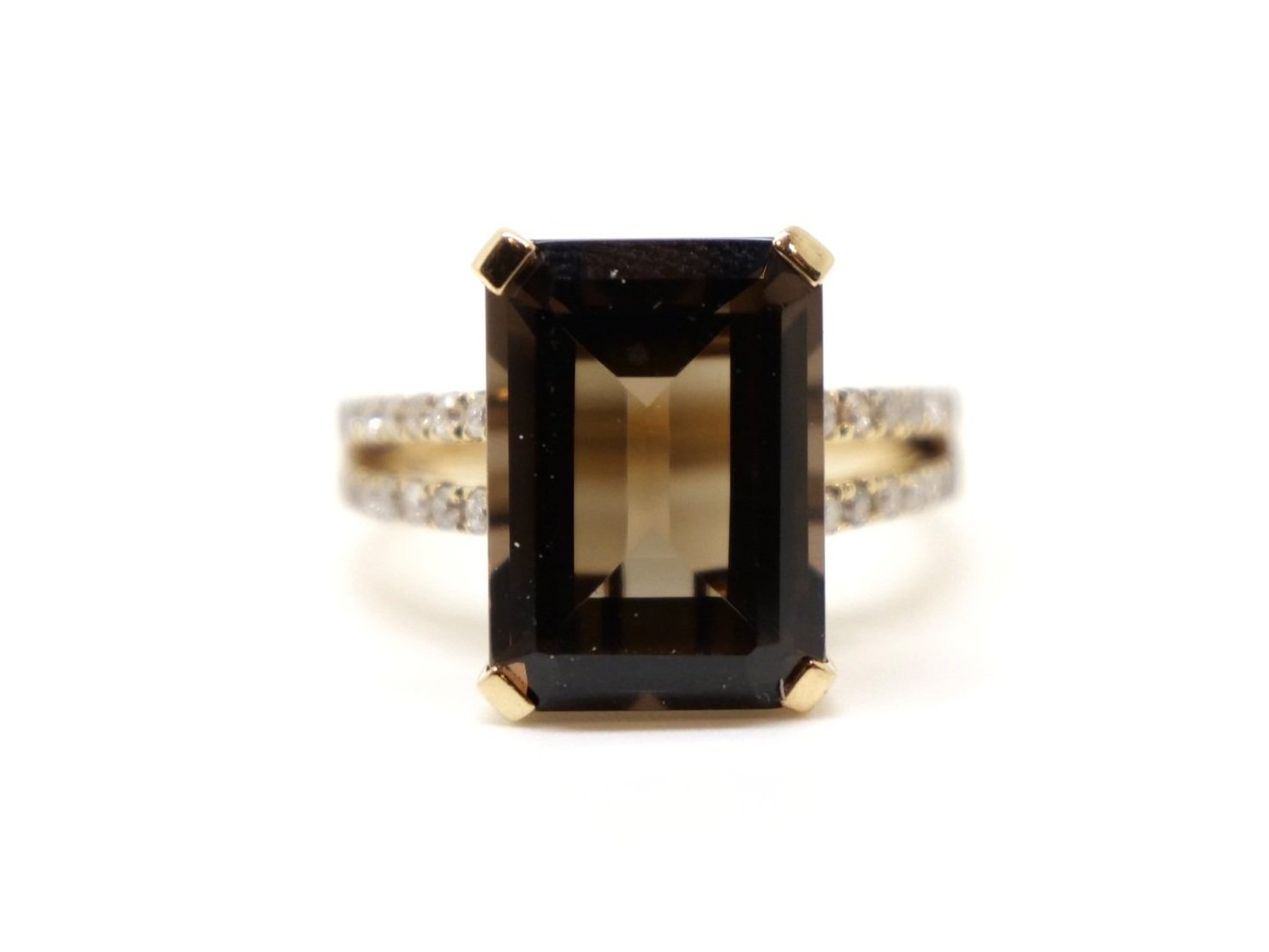 Stunning statement 14ct gold cocktail ring, set with a large emerald cut smoky quartz, with diamonds set down the split shoulders.