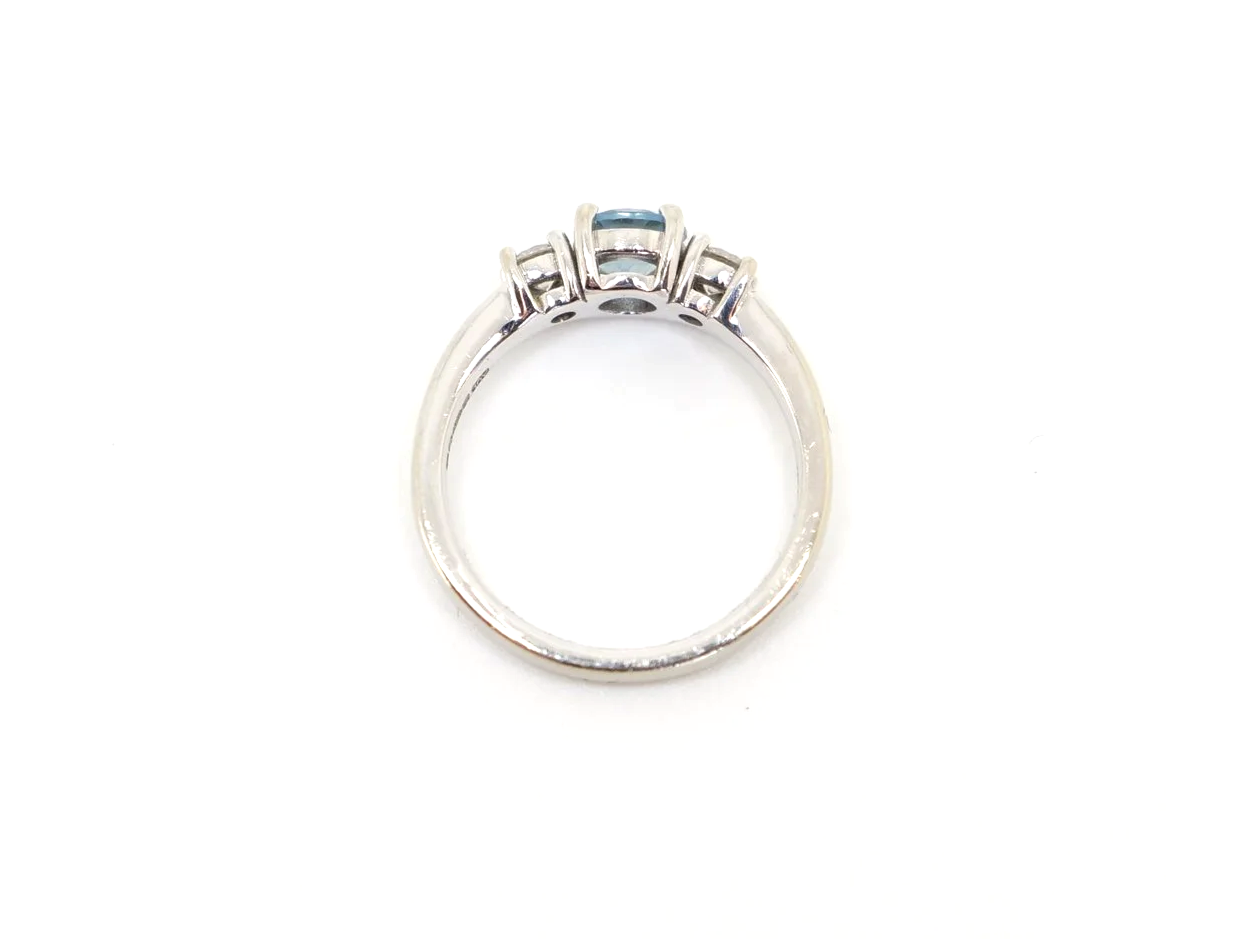 14ct gold aquamarine and diamond three stone ring, round cut aquamarine centre