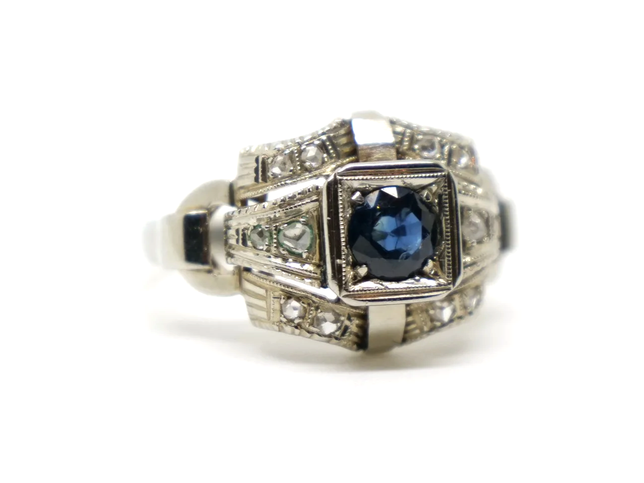 Unusual French Art Deco 18ct gold sapphire and old cut diamond ring, set with a single round cut sapphire. Old cut diamonds set into the unusual design.