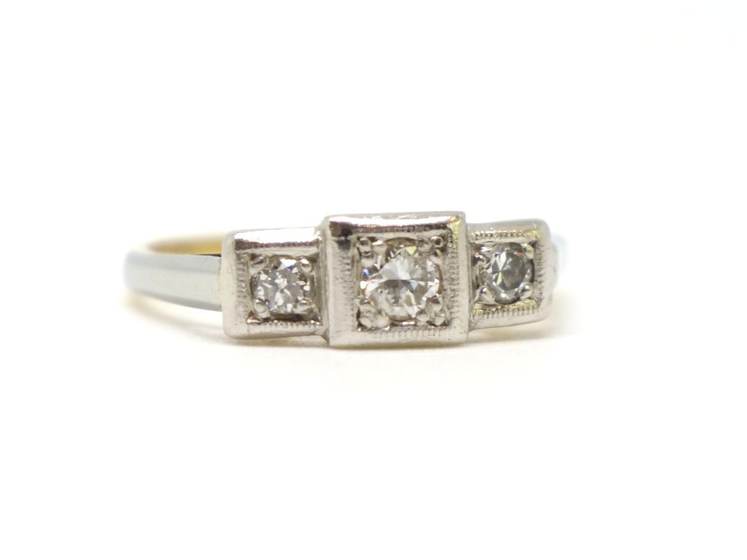 Art Deco diamond three stone ring in 18ct gold and platinum, set with three old cut diamonds in this unusual square shape design.