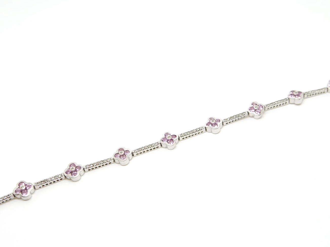 Very pretty 9ct gold pink sapphire and diamond bracelet, set with pink sapphire flowers with diamond links between.