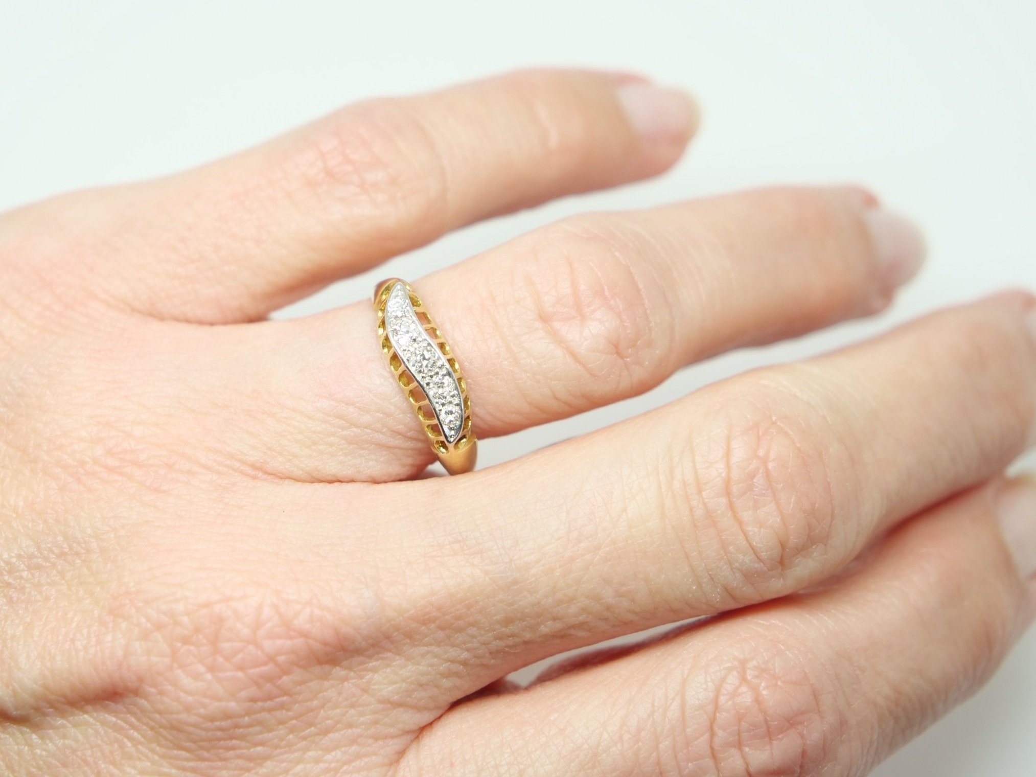 Unusual vintage 18ct gold diamond ring, set with five brilliant cut diamonds in this lovely wave design. Stamped with Chester hallmark and date mark for 1948.