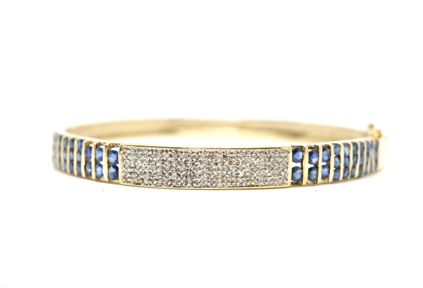 Unusual vintage 9ct gold sapphire and diamond bangle, set with a pave design central panel set with diamonds, with channel set sapphires to each side.
