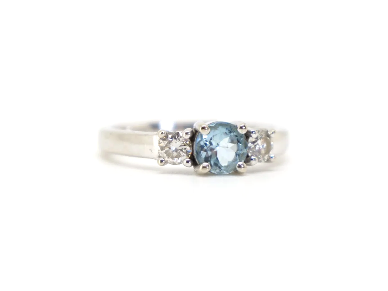 14ct gold aquamarine and diamond three stone ring, round cut aquamarine centre
