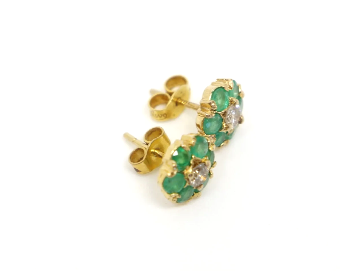 pretty pair of emerald and diamond daisy design vintage earrings in 9ct yellow gold, dating from 1975