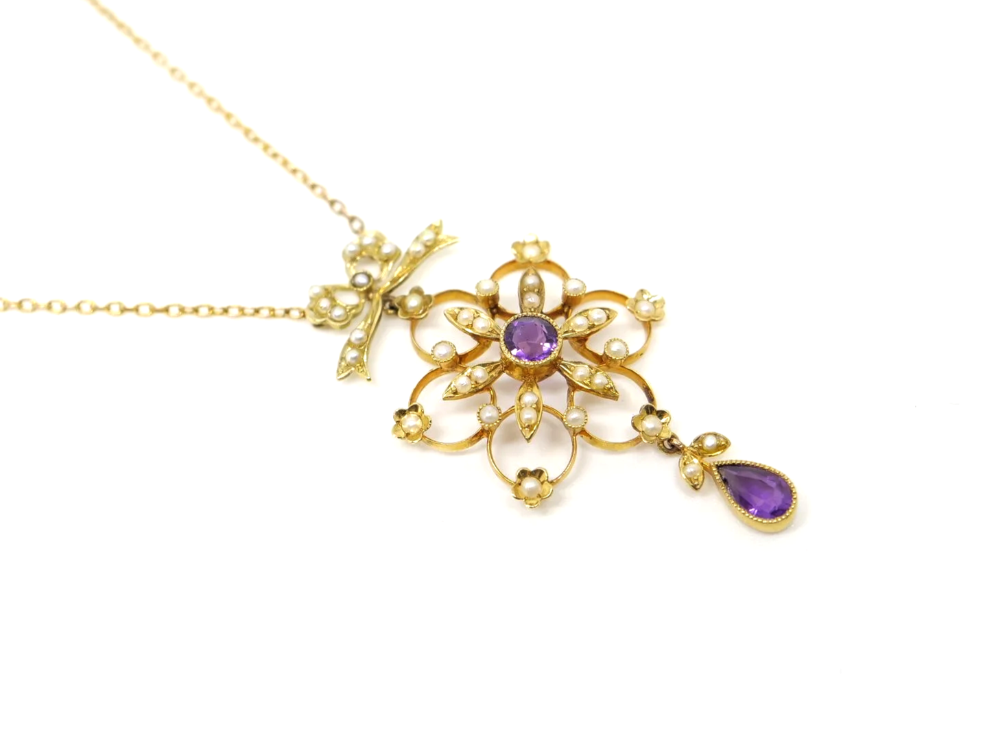Vintage 15ct gold amethyst and seed pearl necklace, with a beautiful bow and snowflake design.
