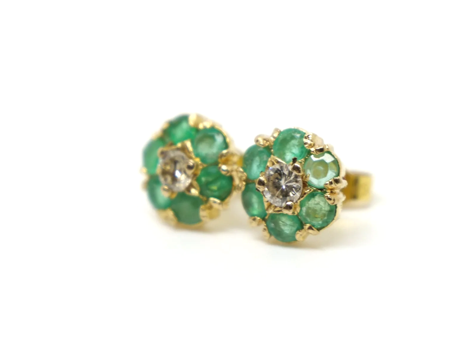 pretty pair of emerald and diamond daisy design vintage earrings in 9ct yellow gold, dating from 1975
