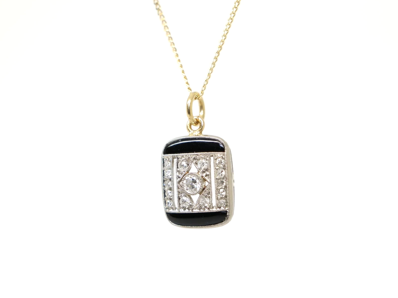 Art Deco onyx and diamond pendant, set in platinum and 18ct gold