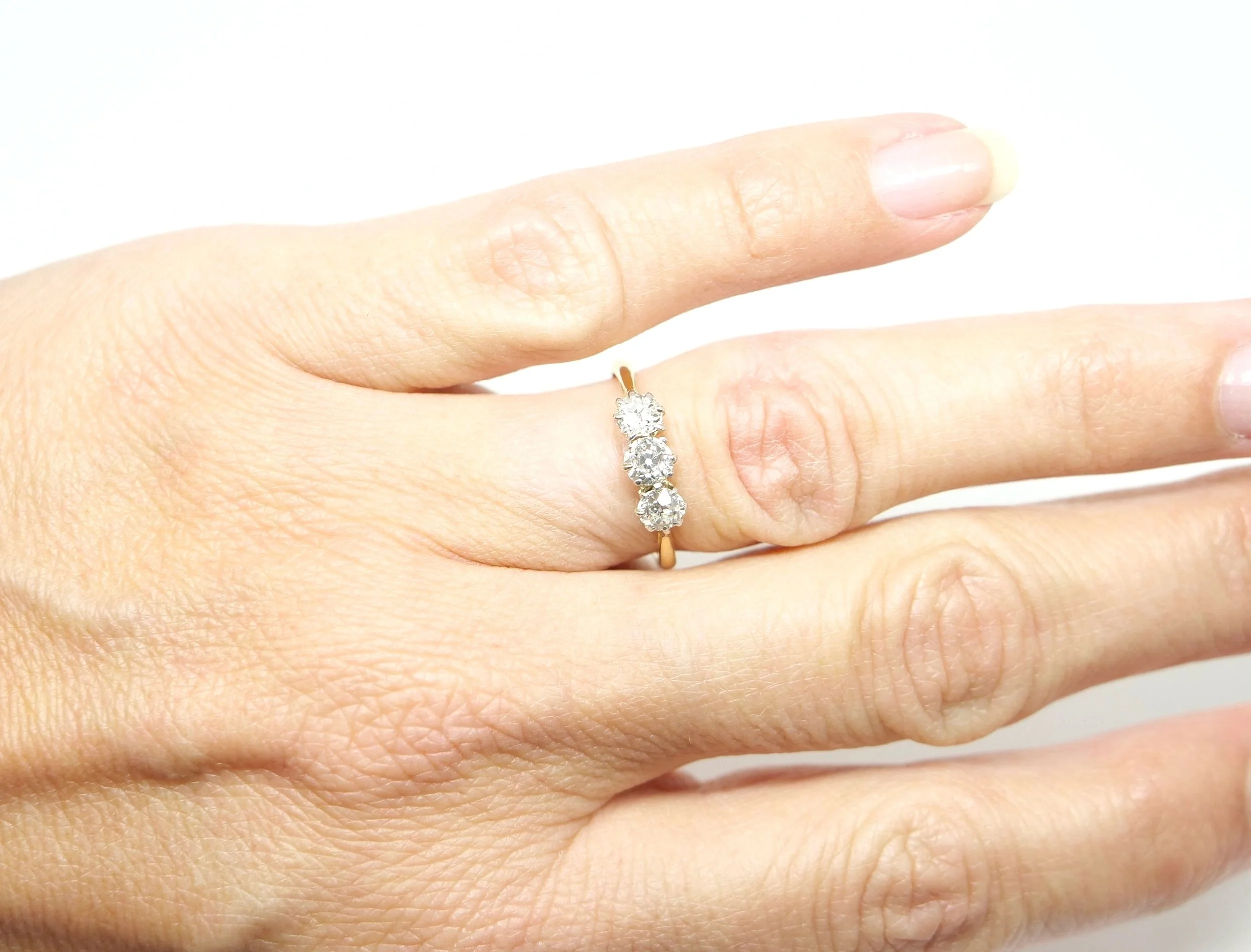 Superb vintage 18ct gold and platinum old cut diamond three stone ring, set with three lovely clean and sparkly old cut diamonds. Total diamond weight approximately 0.72ct.