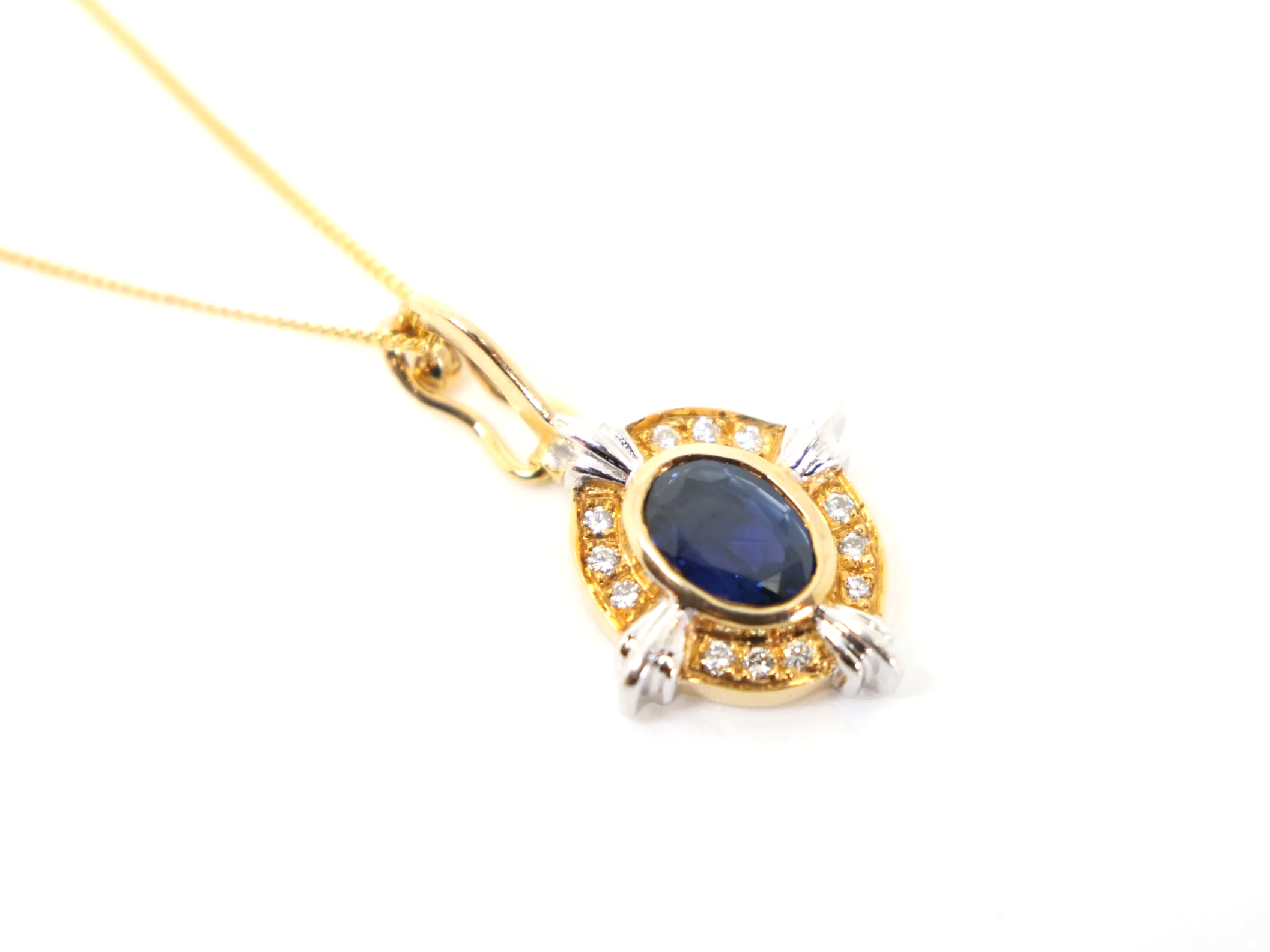 Super 18ct gold vintage 1ct sapphire and diamond pendant and chain.