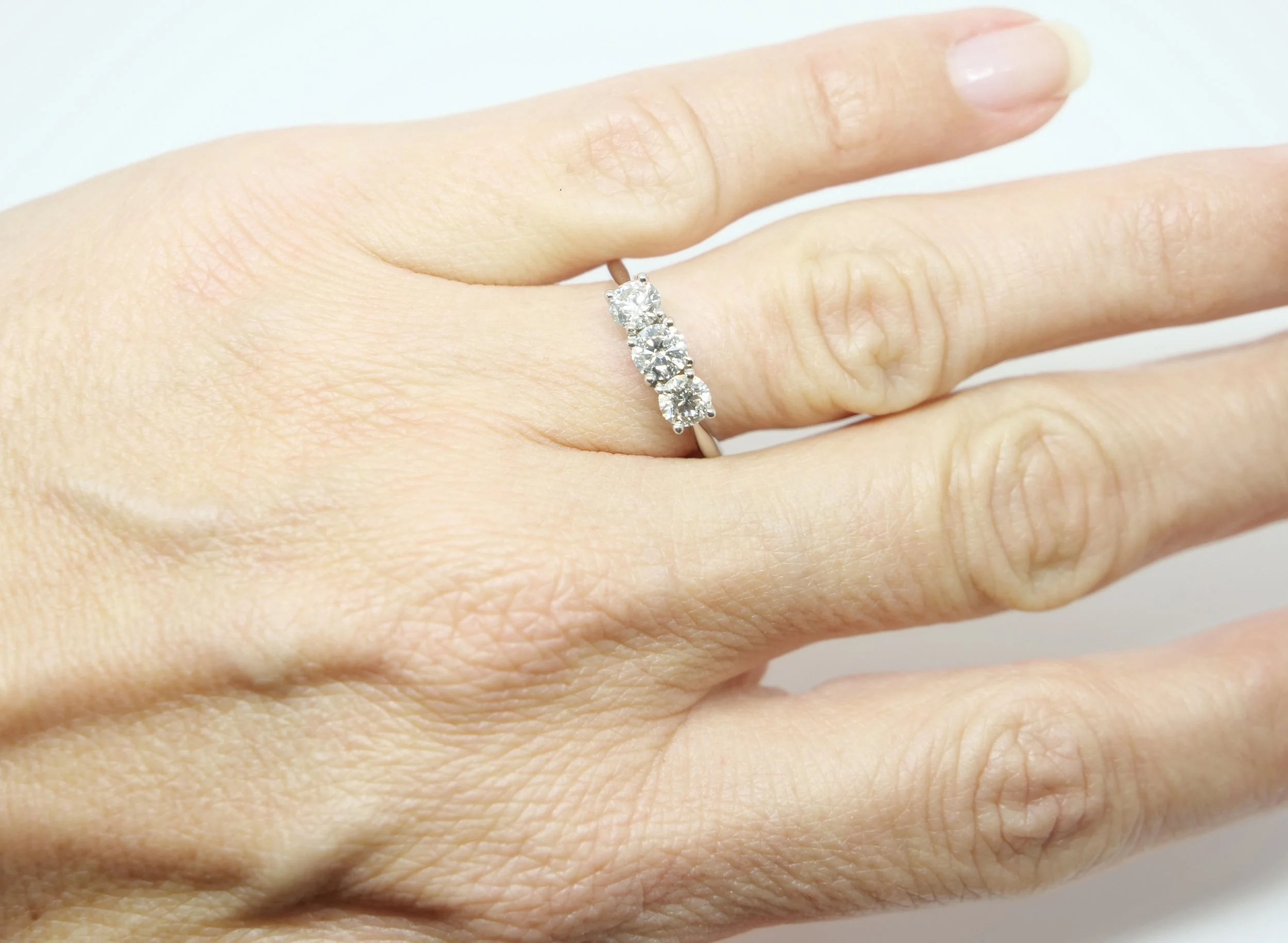 Stunning contemporary 1ct diamond three stone ring in platinum, set with three very sparkly, well matched brilliant cut diamonds.