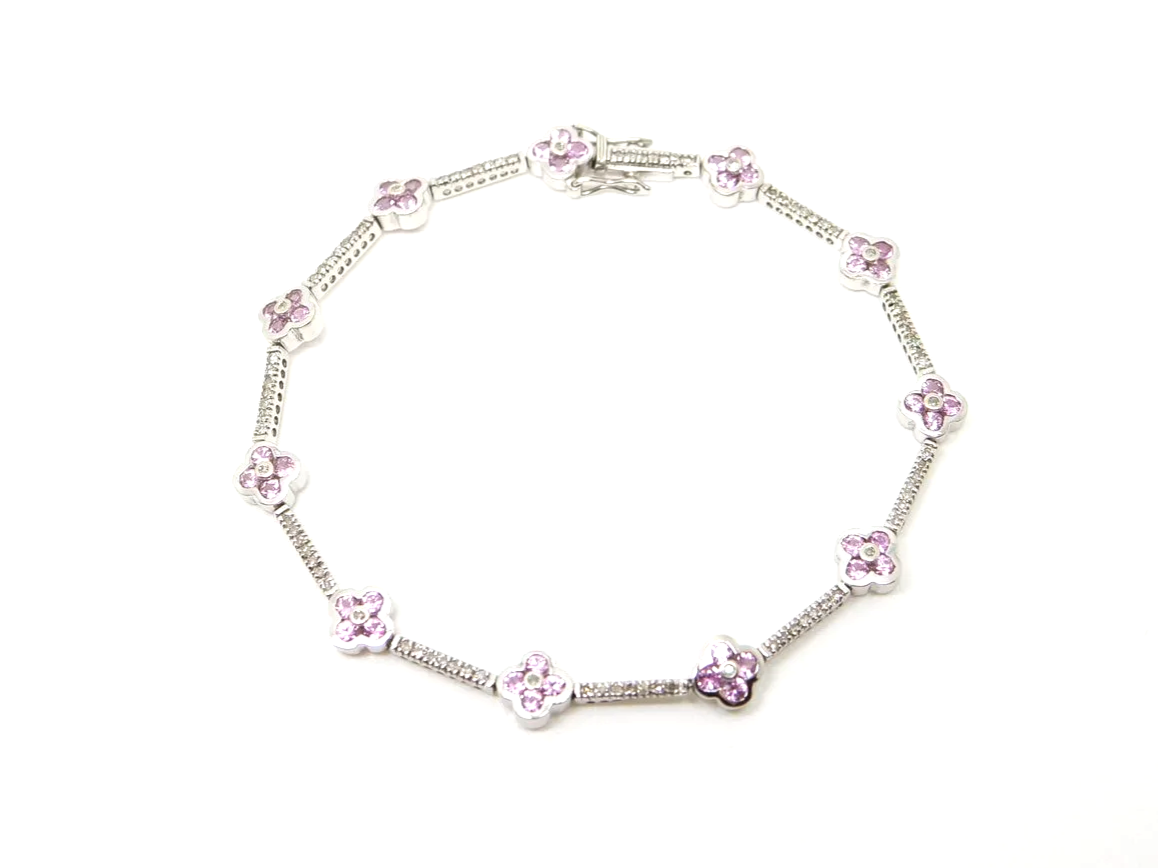 Very pretty 9ct gold pink sapphire and diamond bracelet, set with pink sapphire flowers with diamond links between.