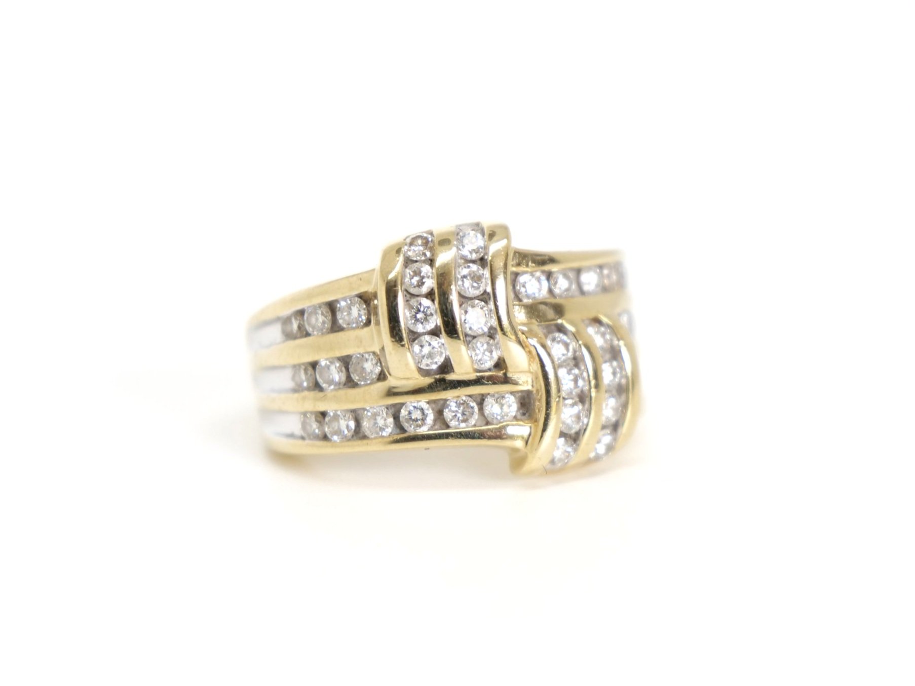 Lovely 14ct gold diamond statement ring, set with forty brilliant cut diamonds in this very unusual cross over design. Approximately 1.2ct diamonds total.