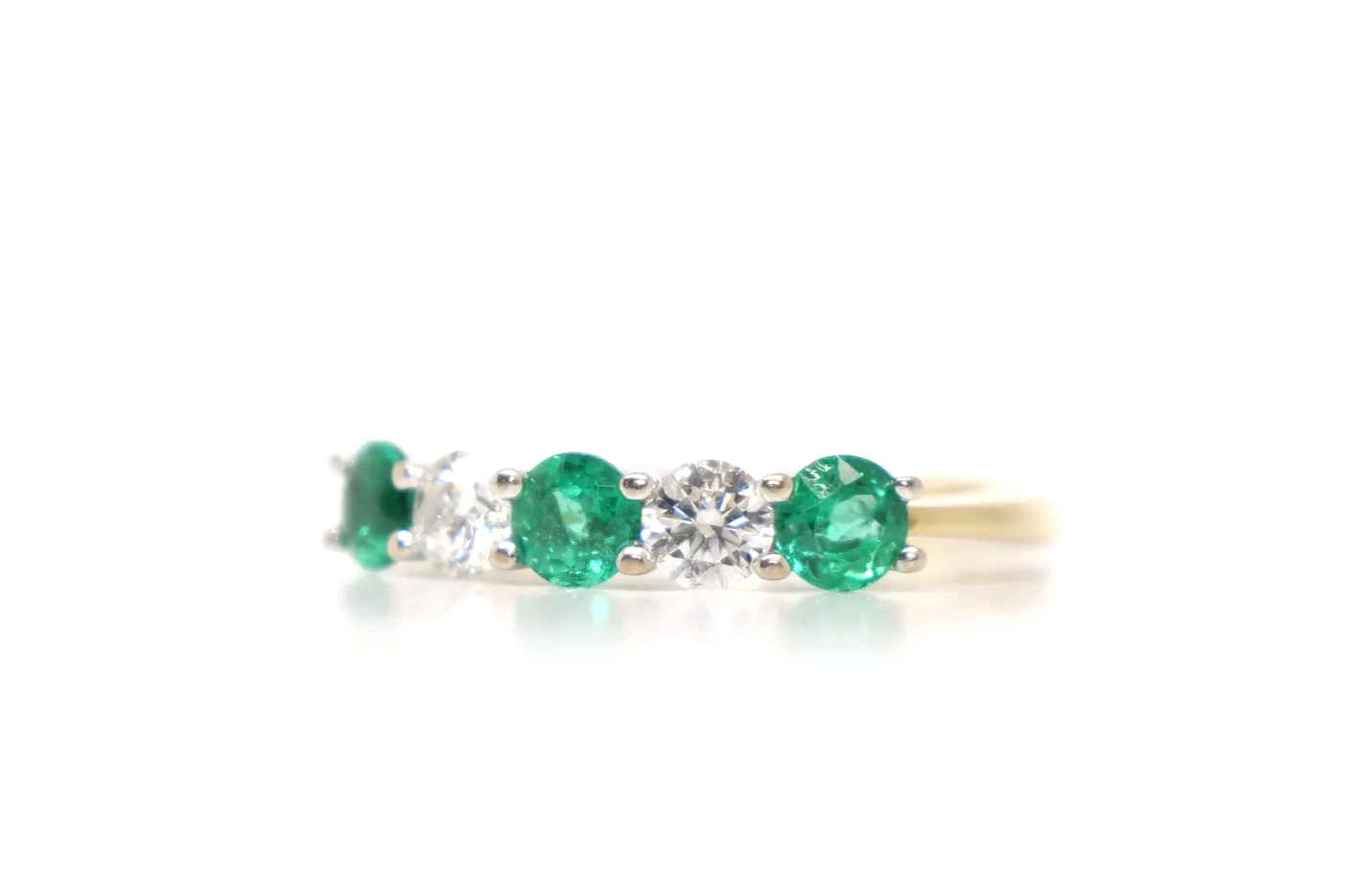 Lovely 18ct gold emerald and diamond five stone ring.