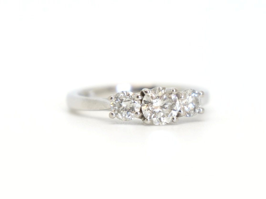Lovely platinum 1ct diamond three stone ring, set with three brilliant cut diamonds. Centre stone approximately 0.5ct, with a further 0.25ct diamond to each side.