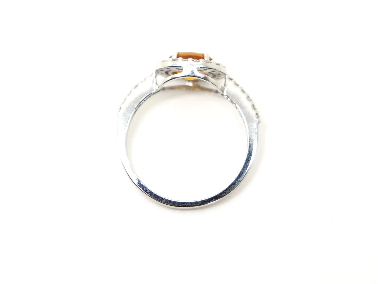 Very sparkly contemporary 18ct gold citrine and diamond ring, set with an oval cut east-west citrine, with a diamond halo.