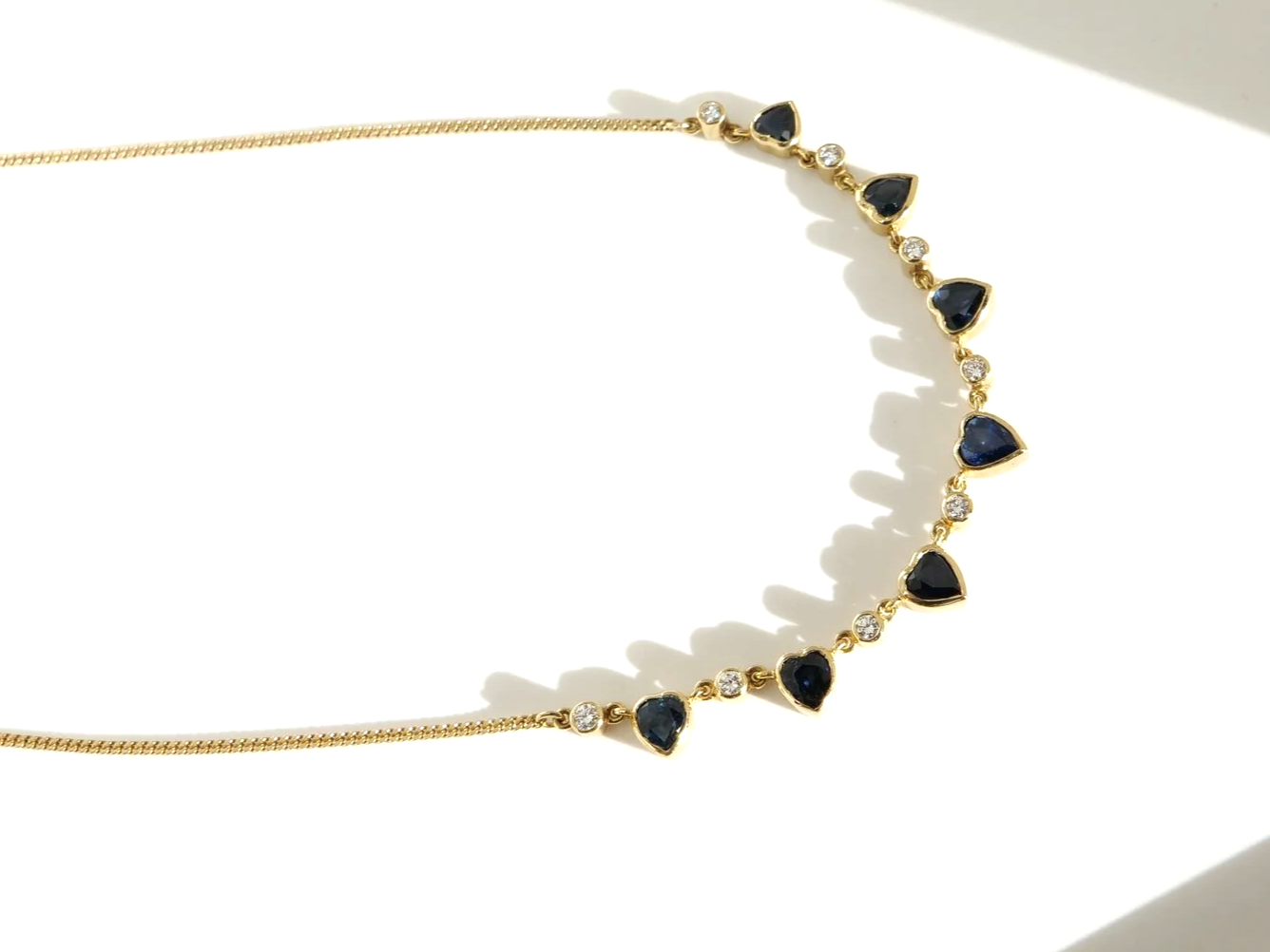 Unusual vintage 18ct gold sapphire heart and diamond necklace.