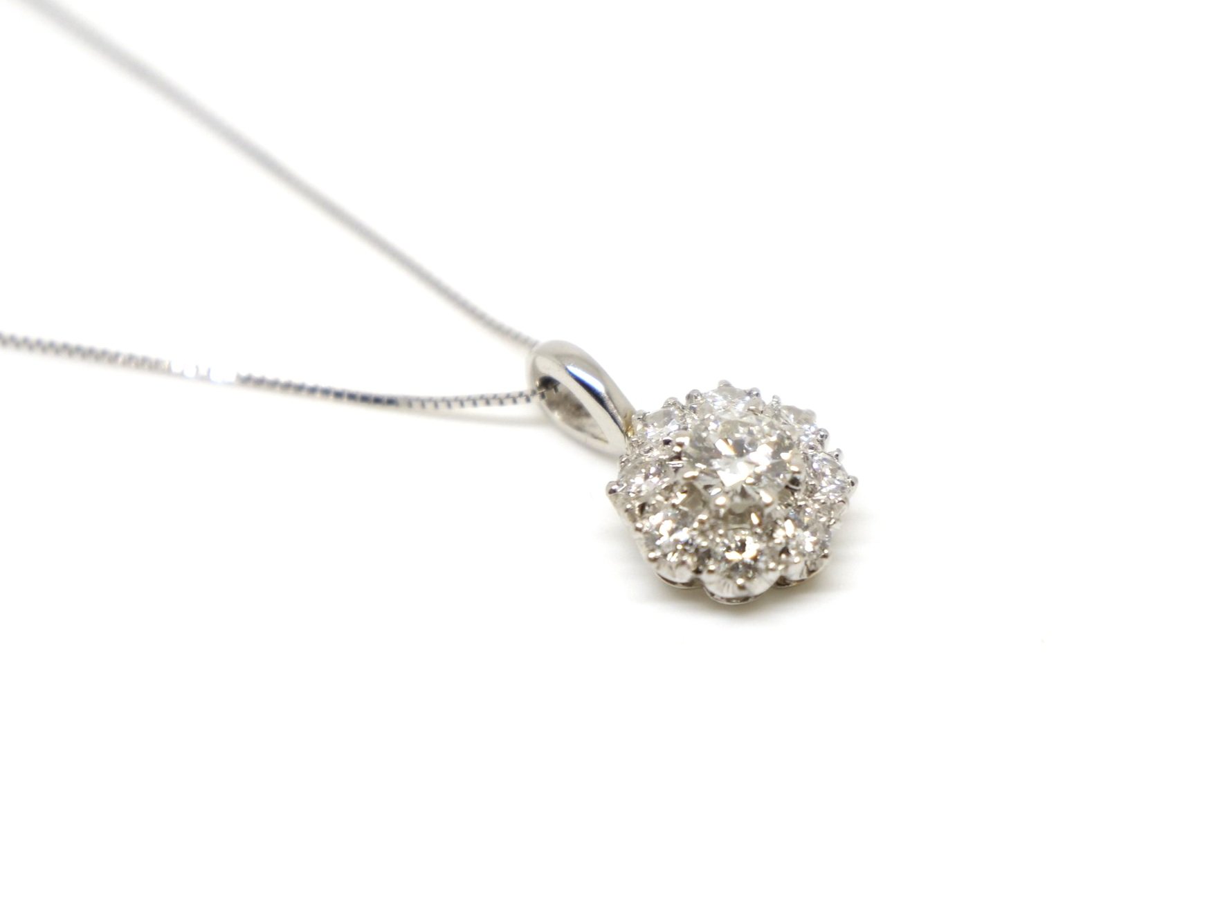 Lovely vintage platinum diamond cluster pendant, with approximately 1ct of old cut diamonds. With 18ct gold 16” chain.