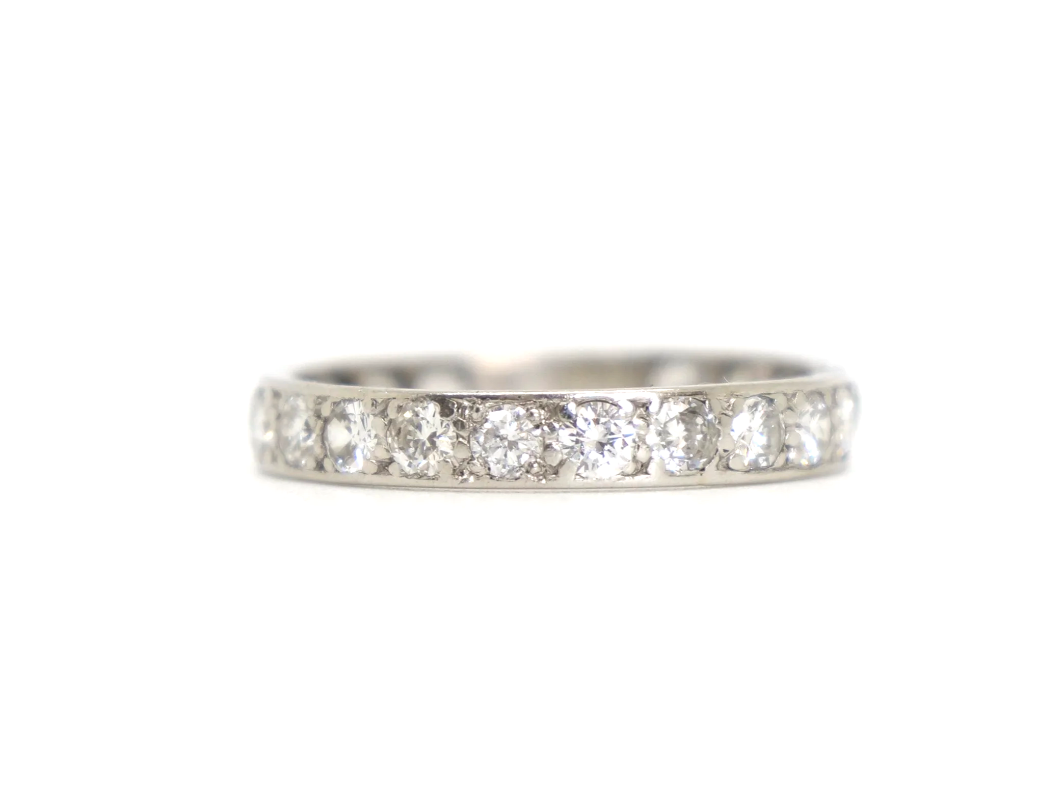A vintage full eternity ring in 18ct white gold, set with round brilliant cut diamonds all the way around the band.