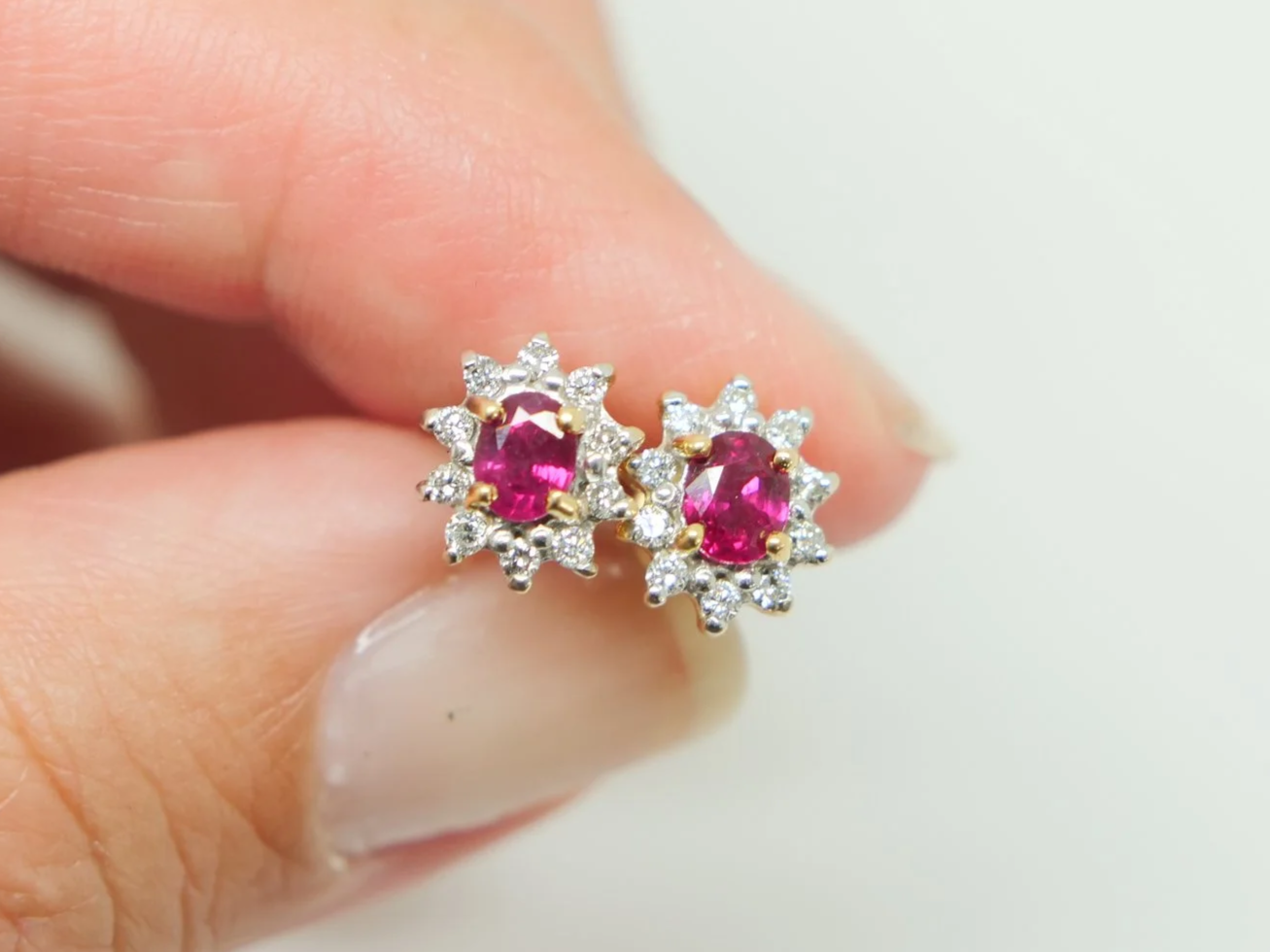 A classic pair of 18ct gold ruby and diamond earrings.