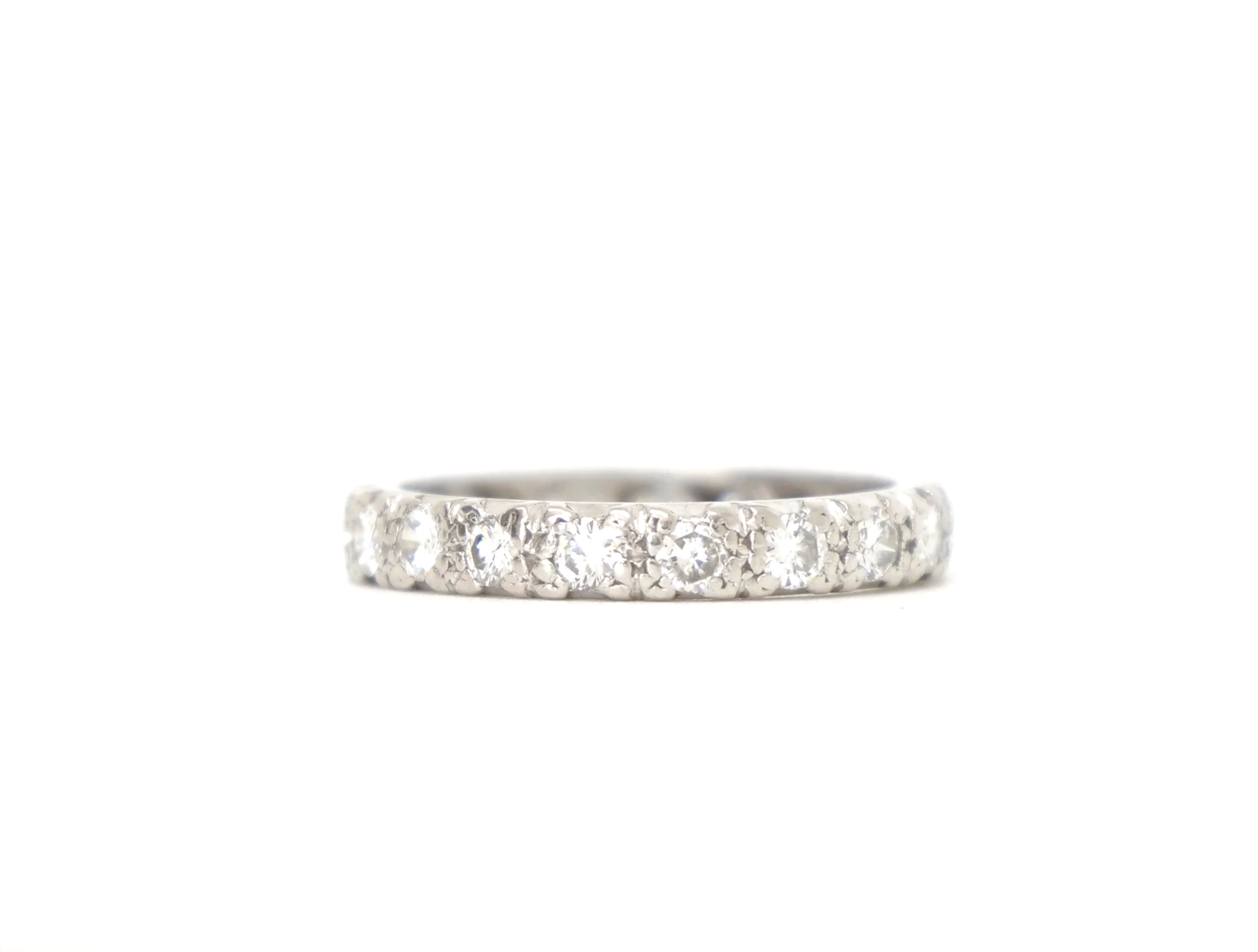A platinum full eternity ring set with round brilliant cut diamonds all the way around the band — 1.5 carats