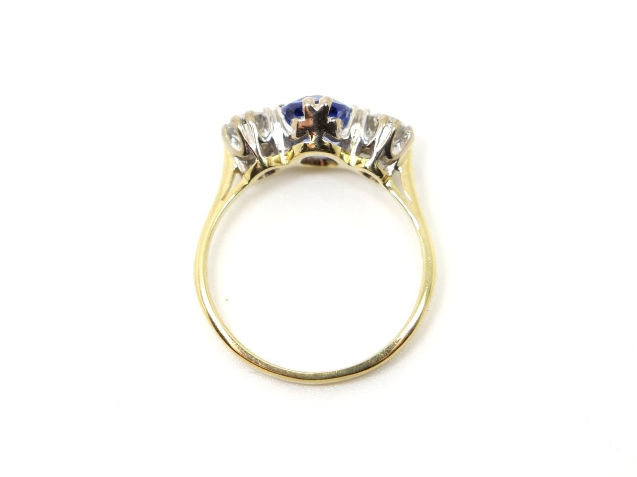 Stunning vintage 18ct gold sapphire and diamond ring, set with an oval cut sapphire with a diamond to each side.