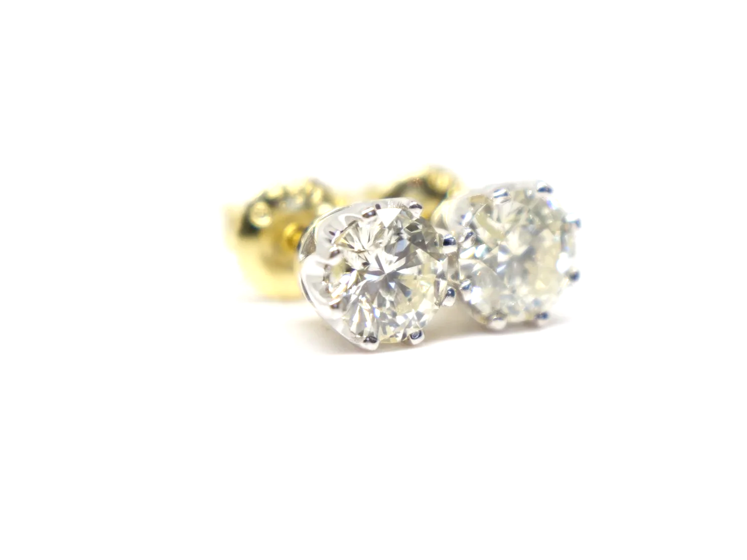 Lovely pair of 18ct white gold diamond stud earrings, each set with a round brilliant cut diamond of approximately 0.85 carats.