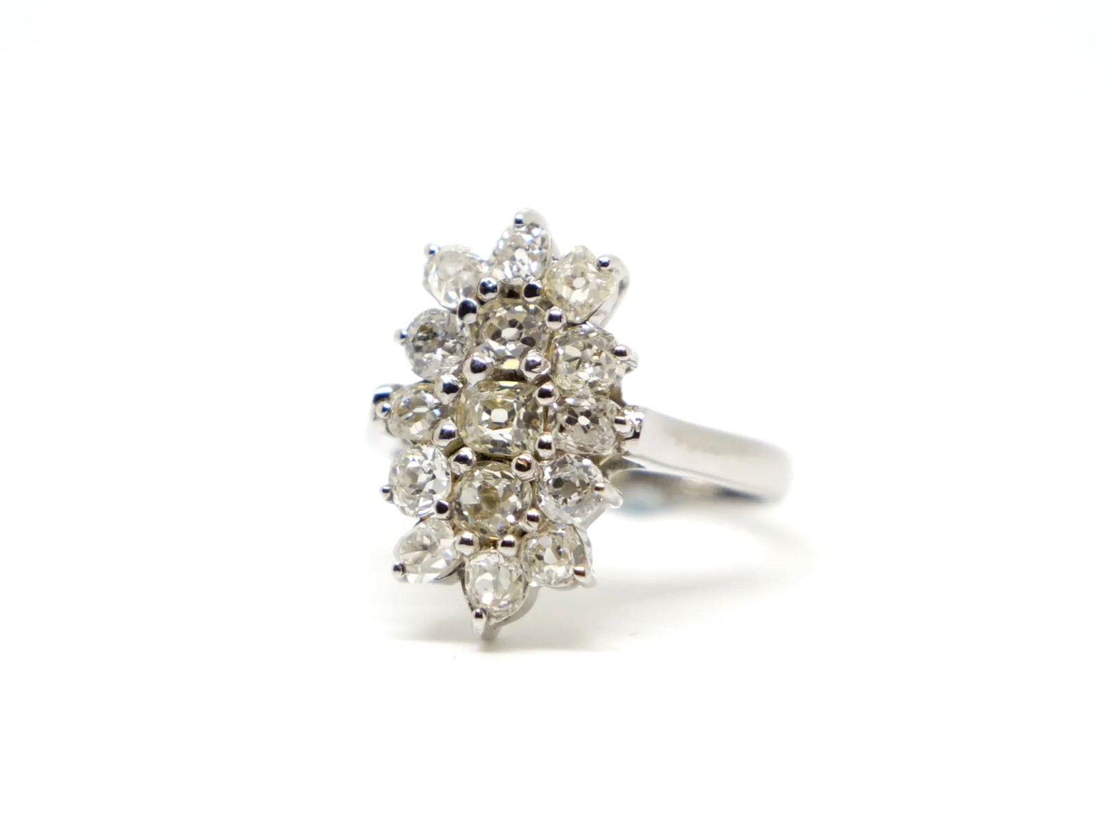Stunning sparkly navette style ring, set with approximately two carats of old cushion cut diamonds.
