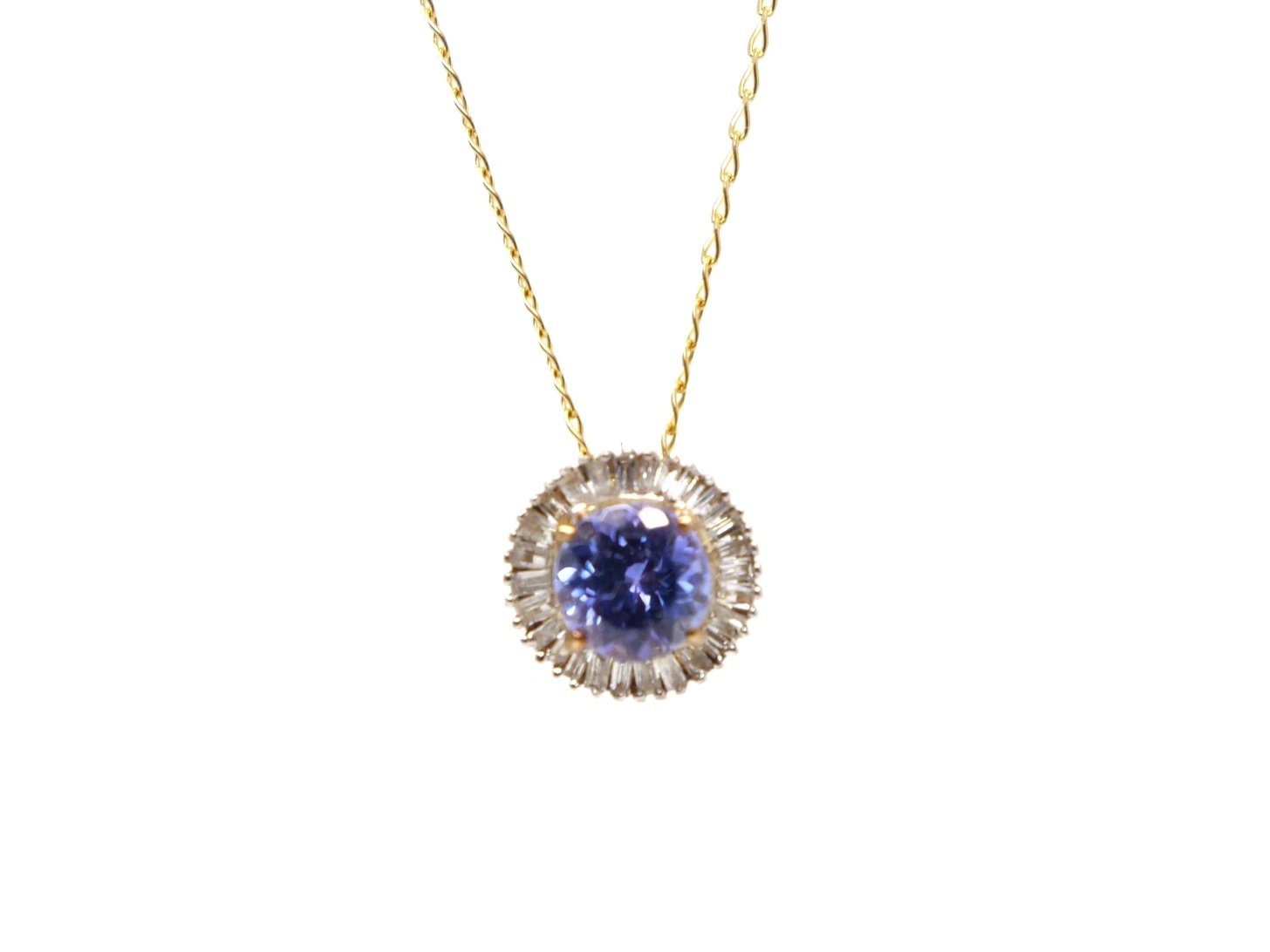 Very pretty contemporary 9ct gold tanzanite and diamond pendant and chain, set with a central round cut tanzanite and surrounded by baguette cut diamonds.