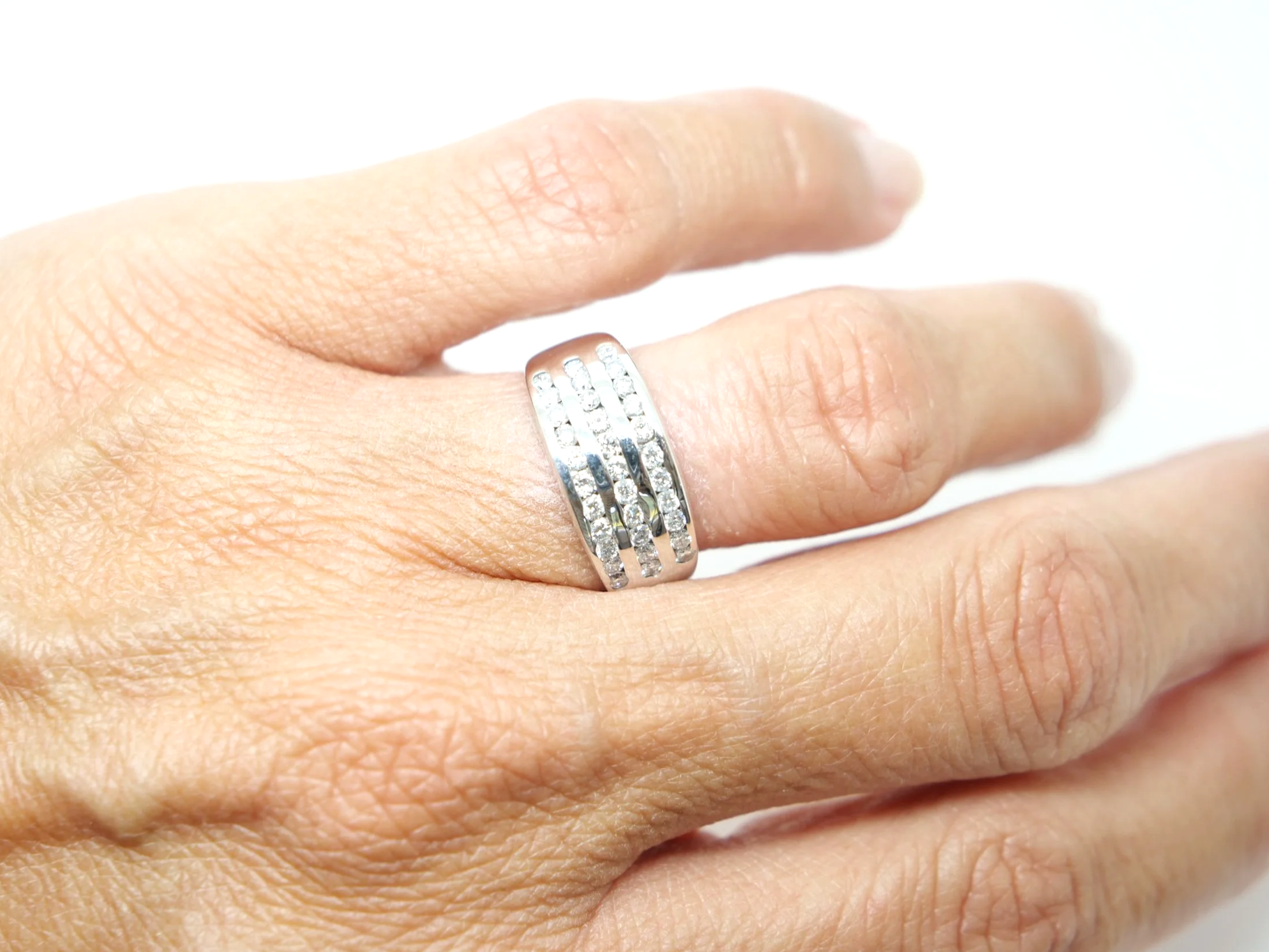 Lovely 18ct gold wide band half eternity ring, set with three rows of brilliant cut diamonds.