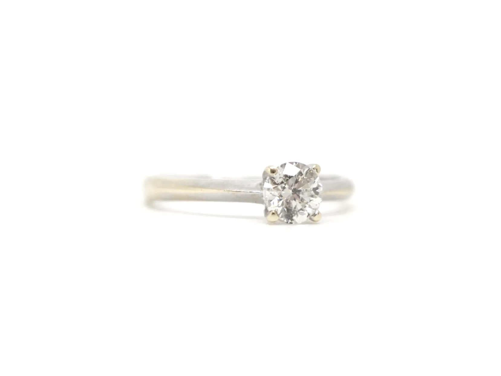A clean, classic diamond solitaire in 14ct gold with a 0.5ct diamond