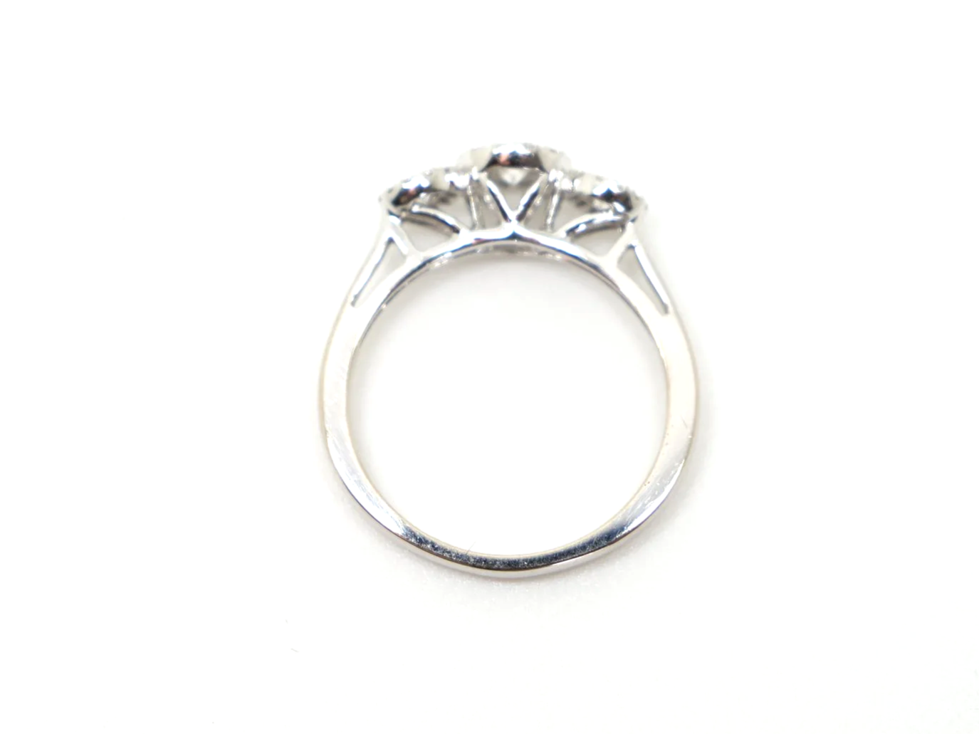 Contemporary 18ct gold diamond ring in a very pretty triple halo three stone design. Approximately 0.5cts diamonds total.