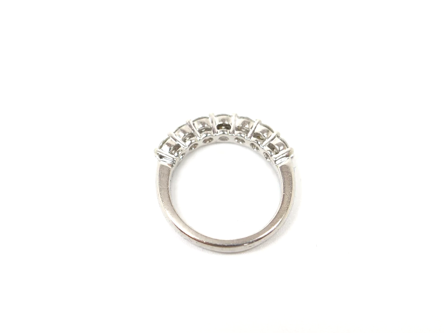 platinum diamond half-eternity ring set with seven round brilliant-cut diamonds