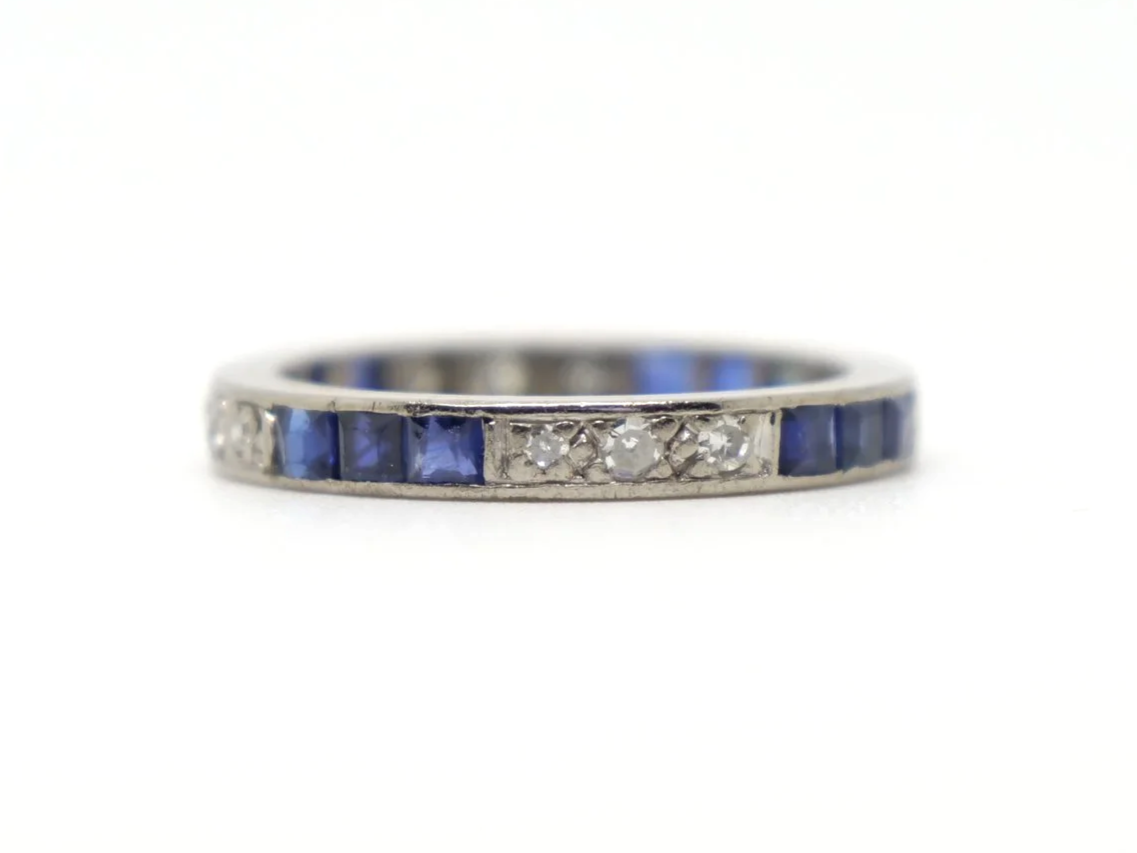 Stunning Art Deco 18ct gold sapphire and diamond full eternity ring, set with alternating step cut sapphires and small diamonds.