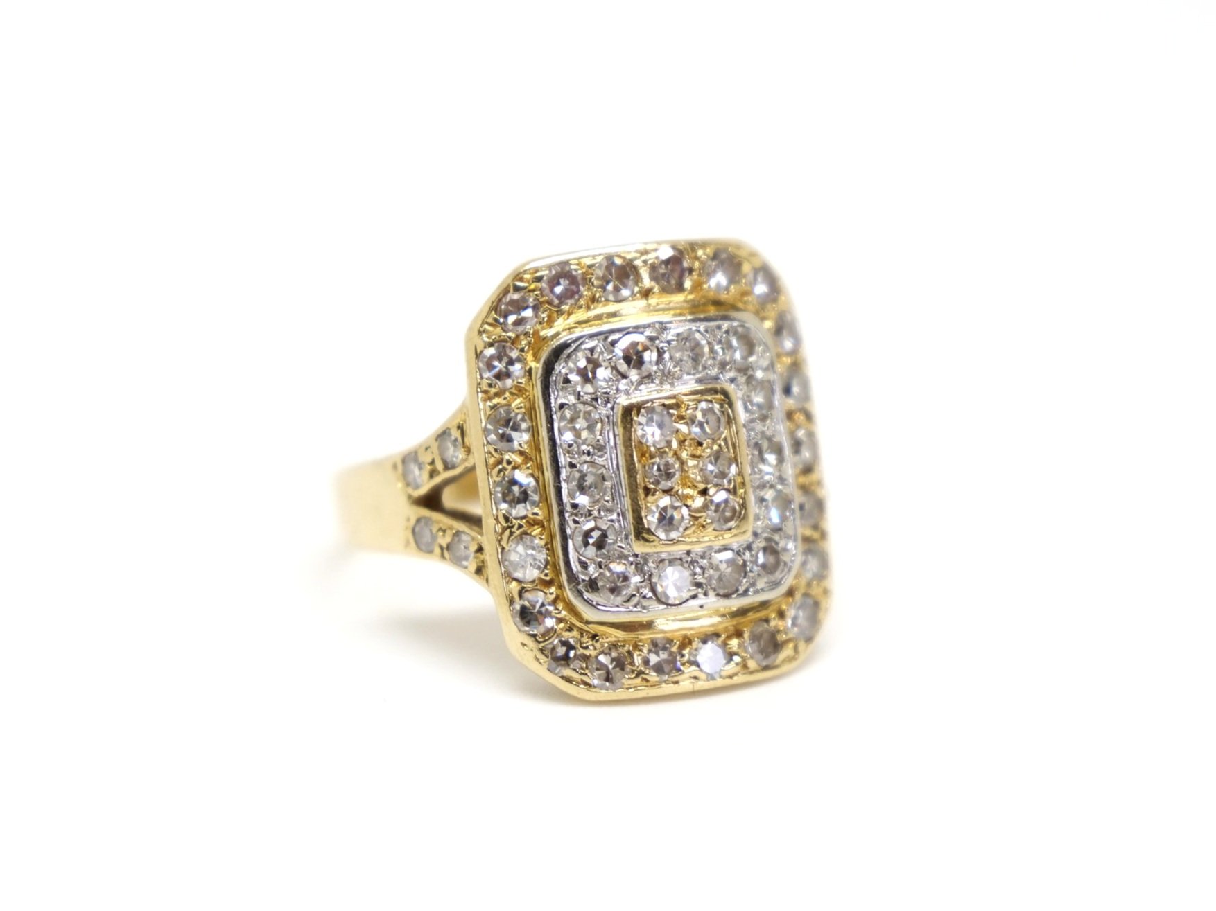 Unusual 18ct gold vintage ring, designed in yellow and white gold in a target style design. Diamonds set throughout the ring and also to each shoulder.