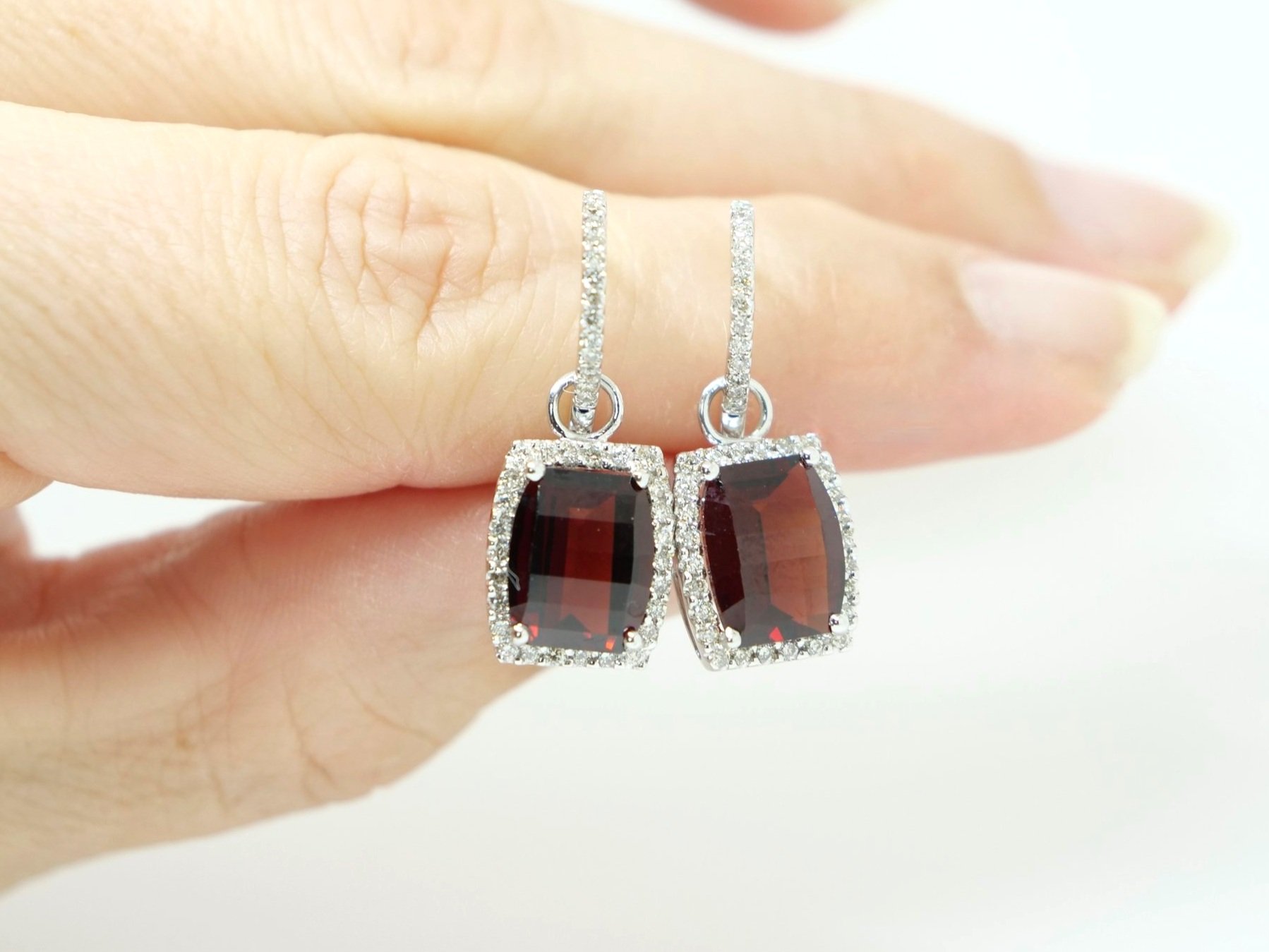 Very nice quality contemporary 14ct gold diamond drop earrings, each set with a chequer board cut garnet and surrounded by diamonds. Further diamonds to earring hoop.