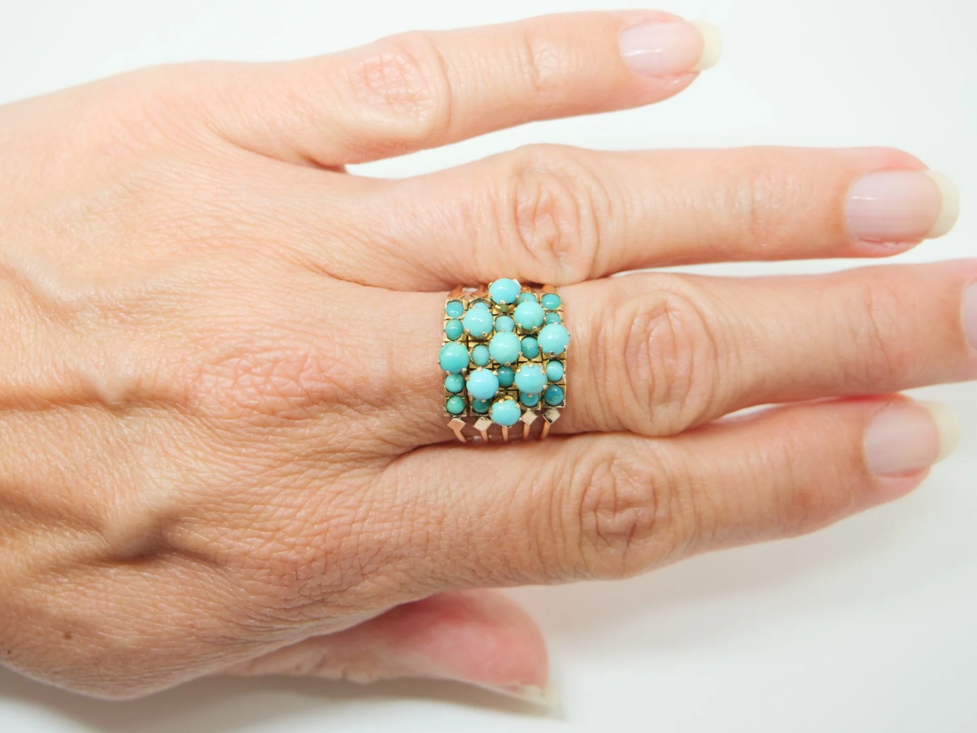 vintage 14ct gold harem ring set with a grid of round turquoise cabochons