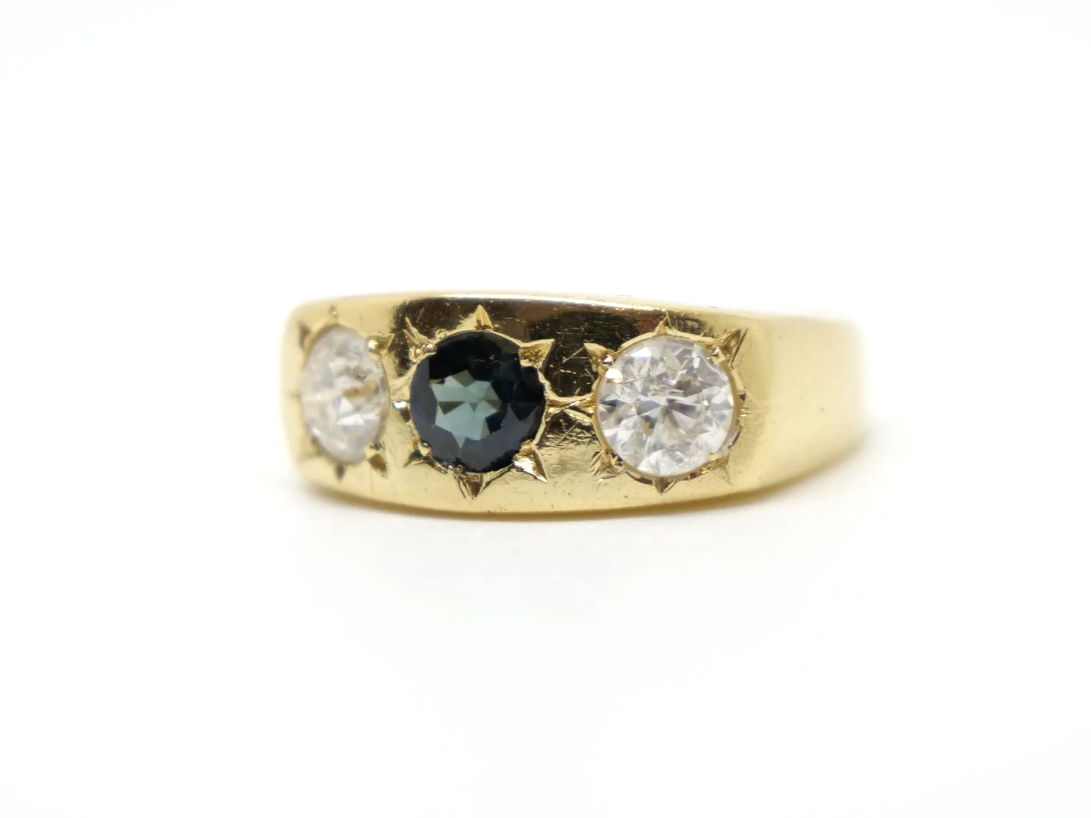 Lovely heavy vintage 18ct gold gypsy ring, set with a round cut sapphire and two brilliant cut diamonds measuring approximately 1ct total.
