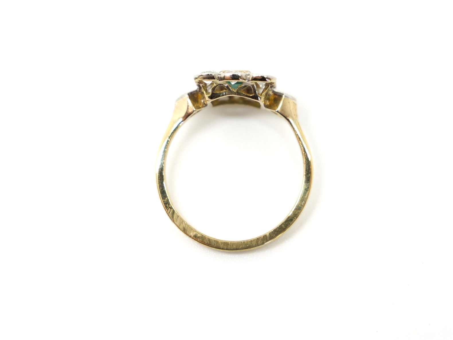 Very pretty vintage 18ct gold emerald and diamond ring, set with an emerald cut emerald and surrounded by diamonds.