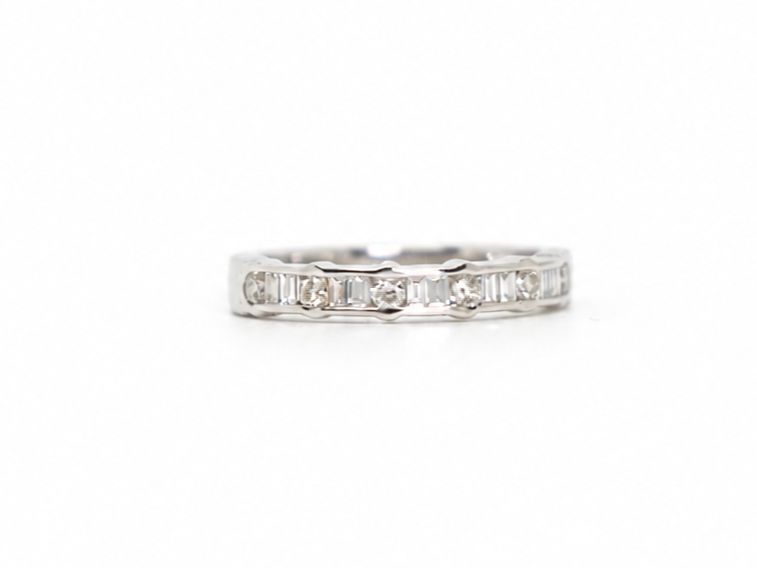 18ct white gold half eternity ring with alternating round and baguette cut diamonds